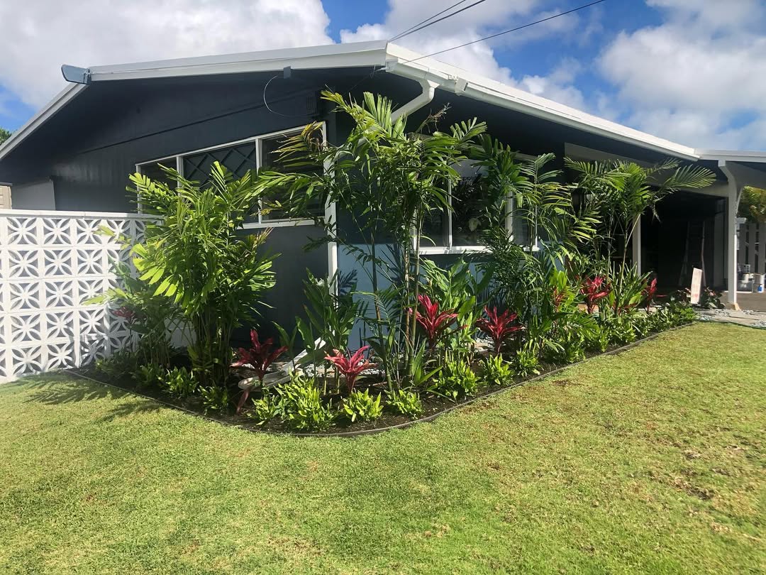 Manicured tropical flower bed and paver edging installation in Olomana neighborhood