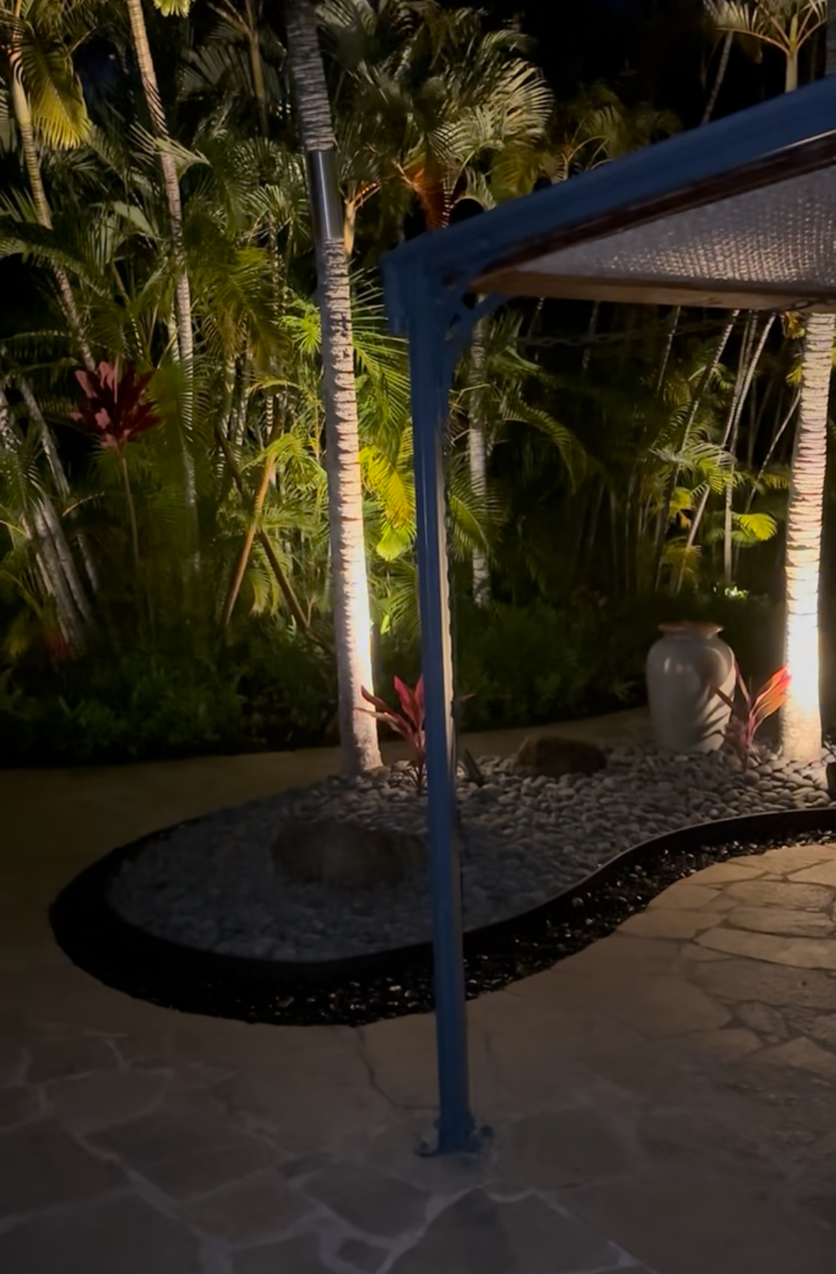Custom landscape lighting and palm tree uplighting installation in Kailua Oahu