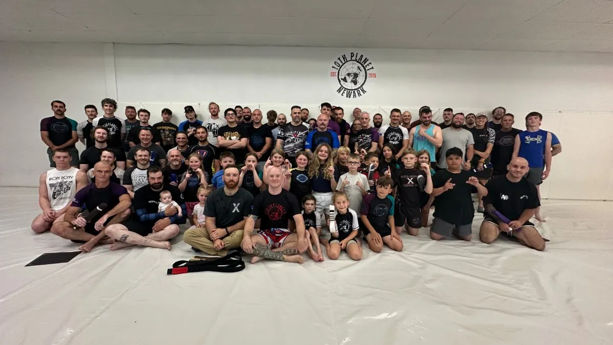 Large team photo of 10th Planet Newark adults and kids on the mats in Heath, Ohio