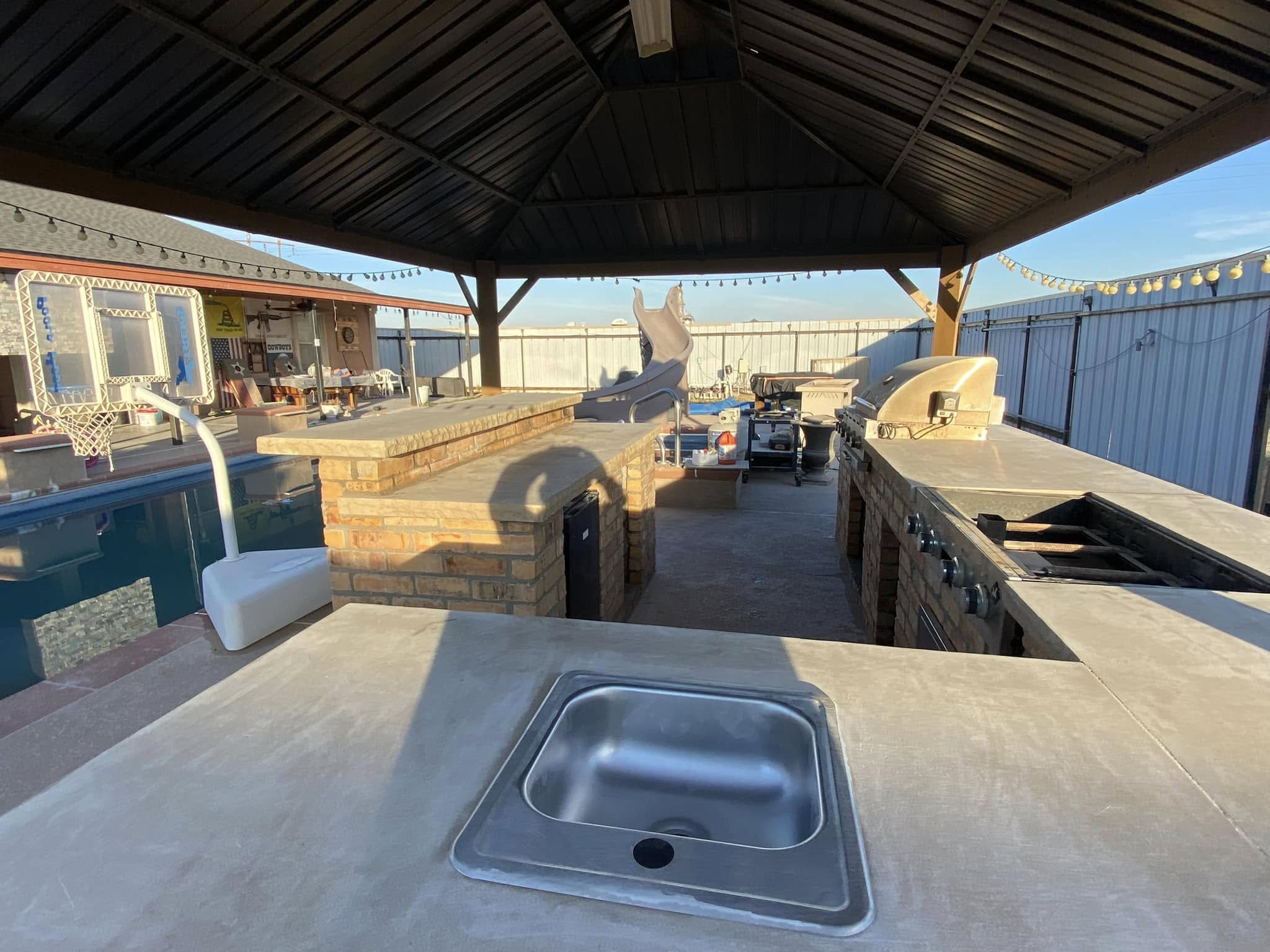 Outdoor Kitchen and Stone Fireplace Installation in Midland TX