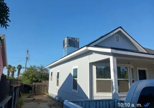 HVAC technician repairing a residential air conditioning unit