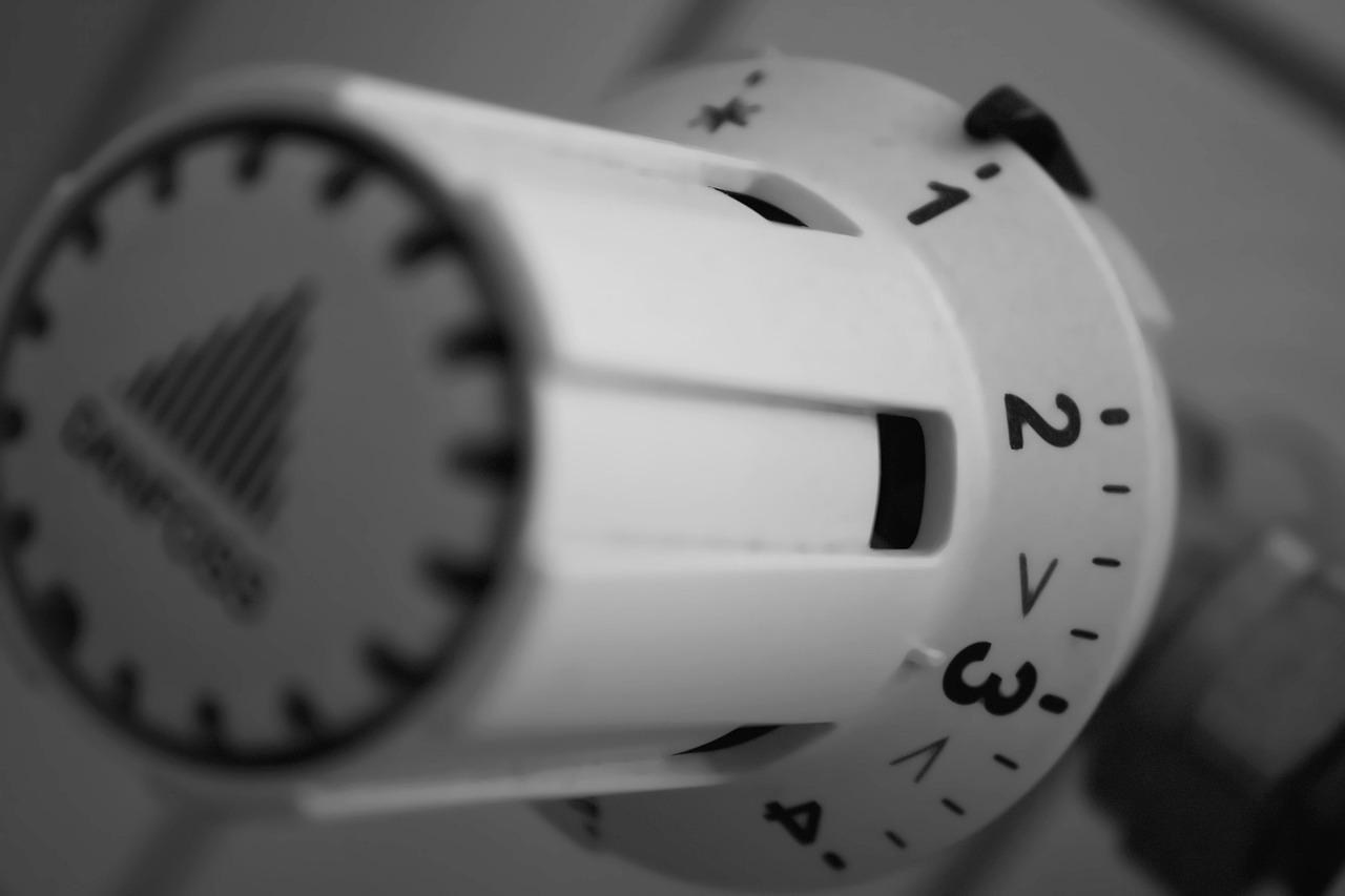 Technician performing HVAC tune-up to improve energy efficiency