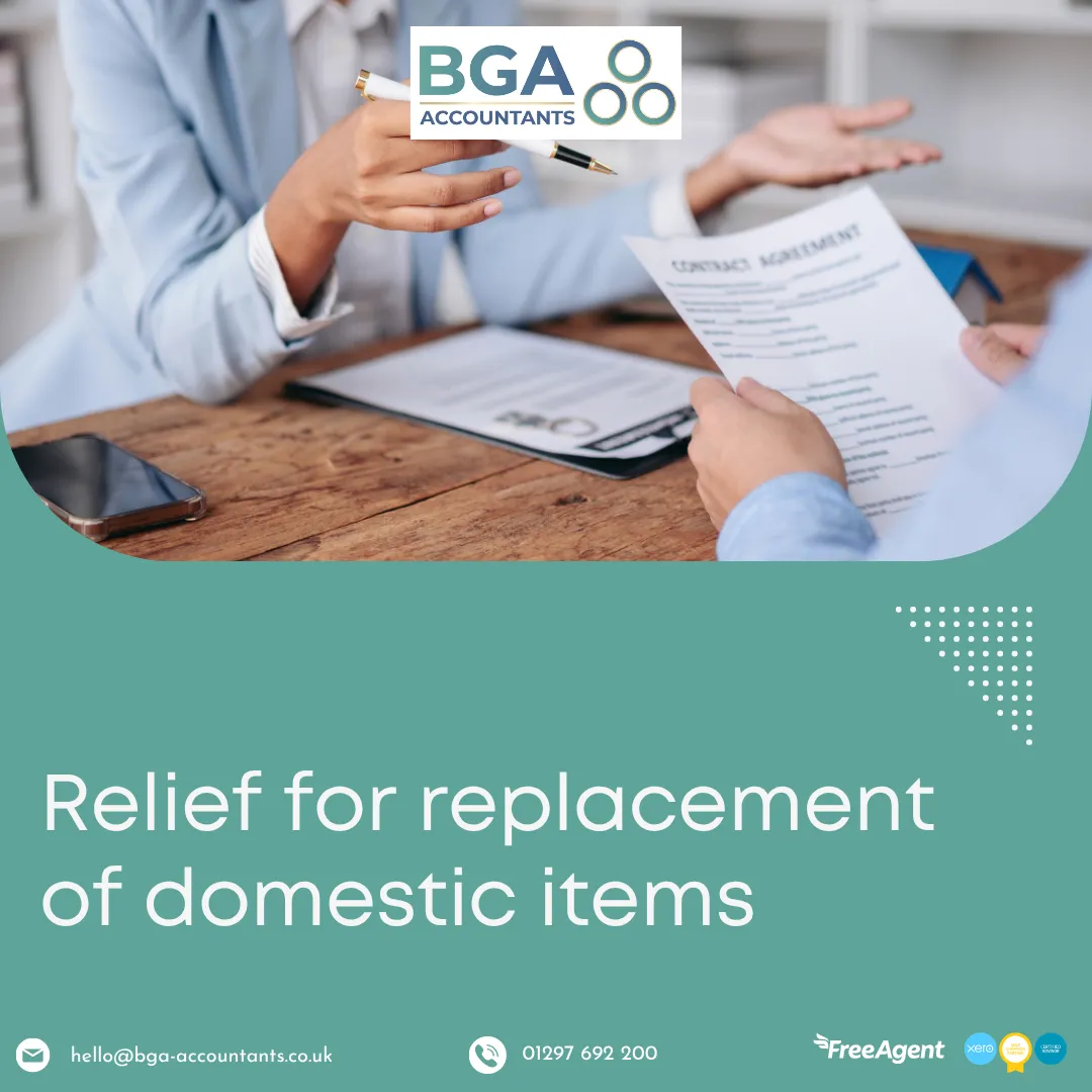 Person reviewing documents across a table representing landlord tax rules and relief for replacement of domestic items in UK rental properties.