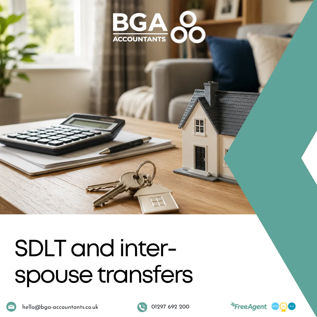 House model, keys and calculator representing SDLT considerations when transferring property between spouses.