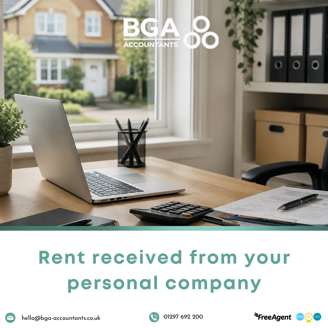 Home office with a laptop, calculator and paperwork representing rental income and company tax planning.