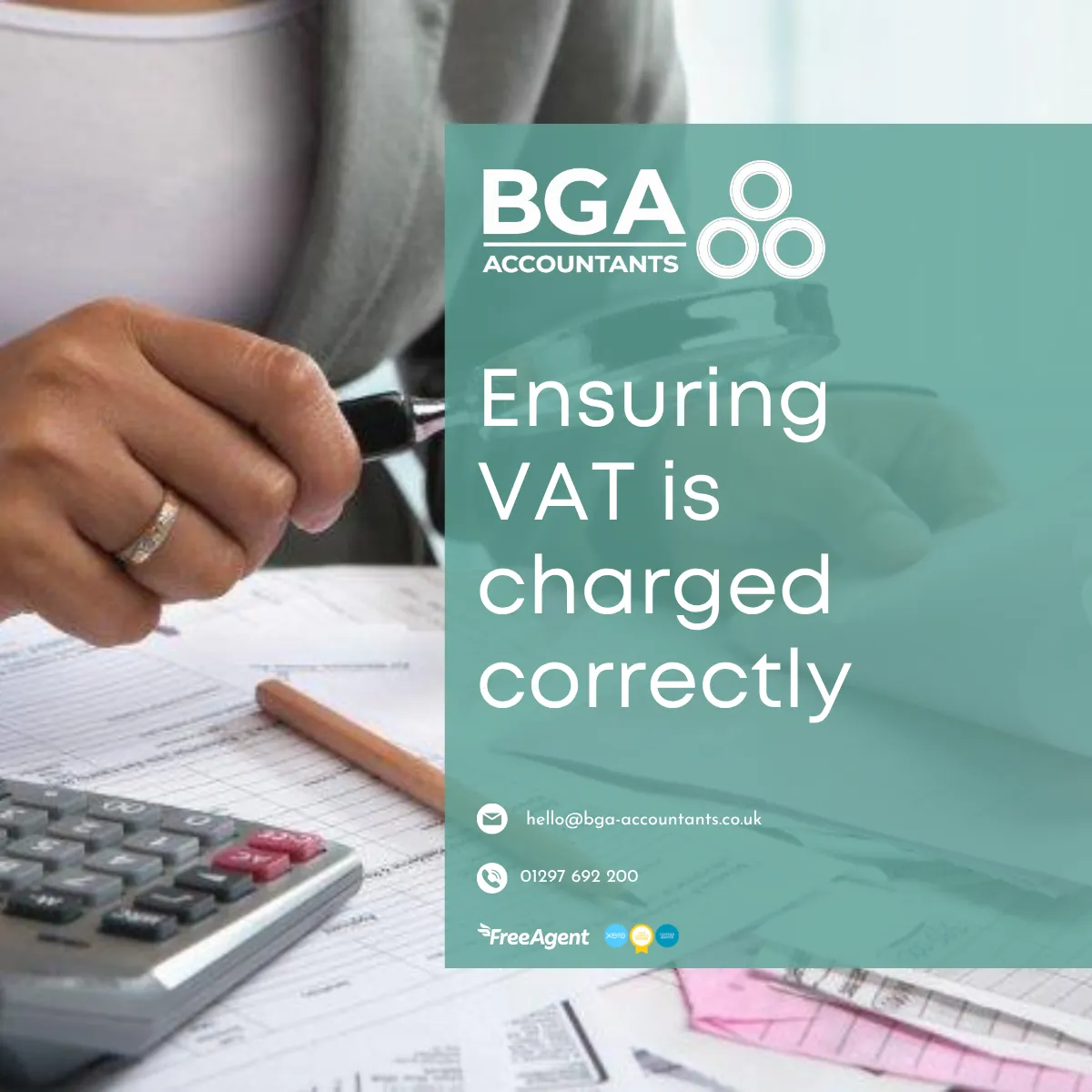 Business professional reviewing financial documents with a calculator, representing VAT calculations and tax compliance.