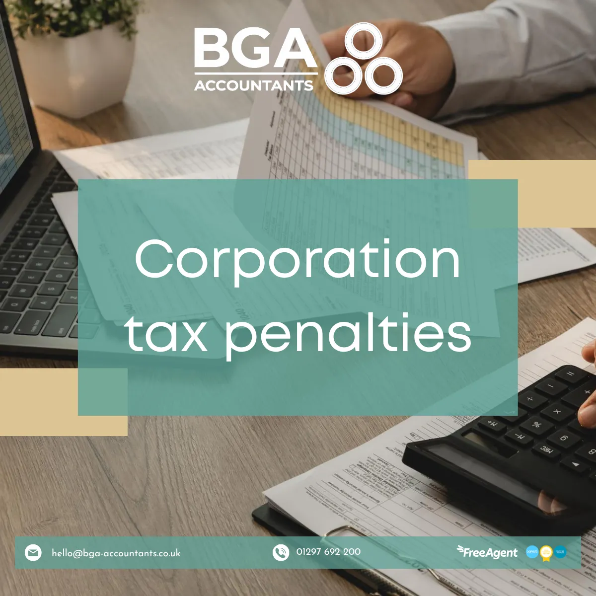Business documents, calculator and laptop representing Corporation Tax calculations, company tax returns and filing deadlines.