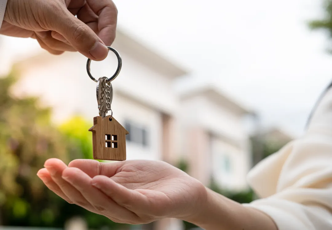 a living room filled with furniture and a kitchen