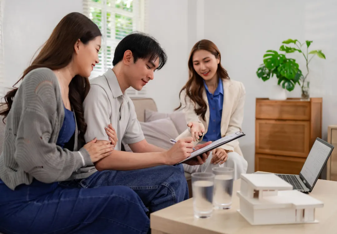 a modern house with a pool and lounge chairs