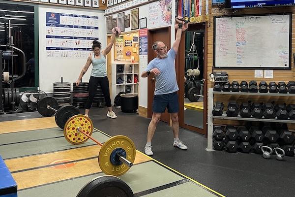 Two athletes completed one armed kettlebell snatches
