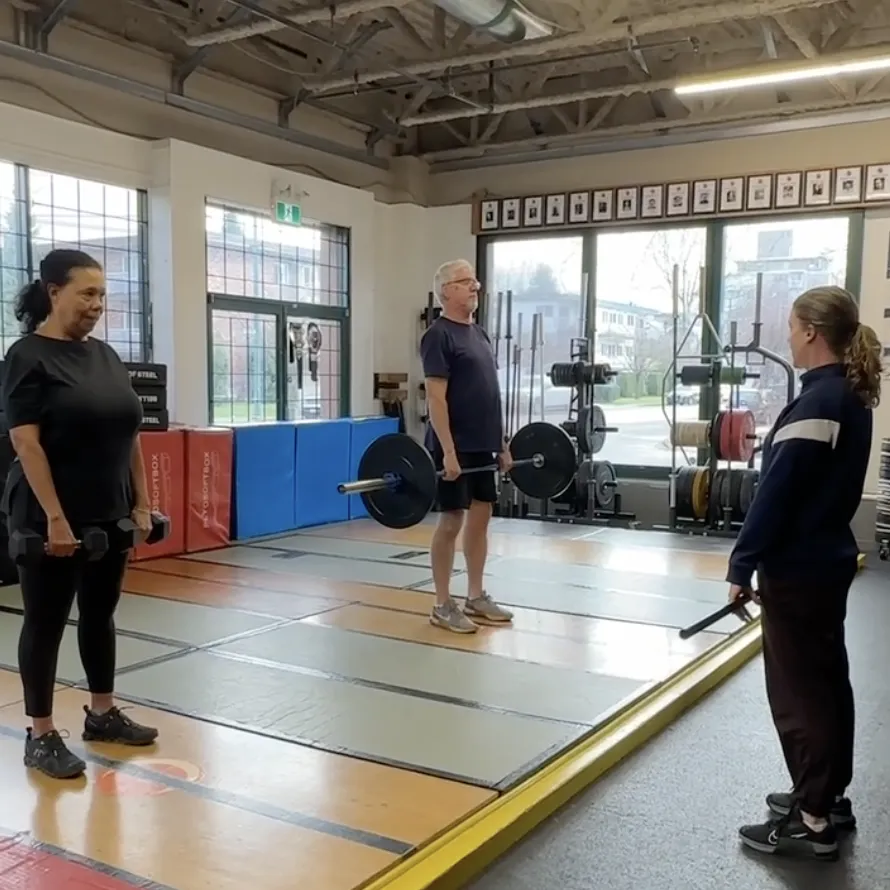 Coach Holly with two athletes