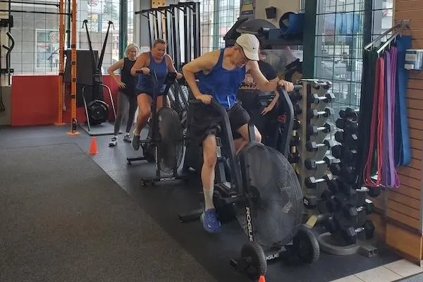 Female athlete performing a deadlift at the Empower gym
