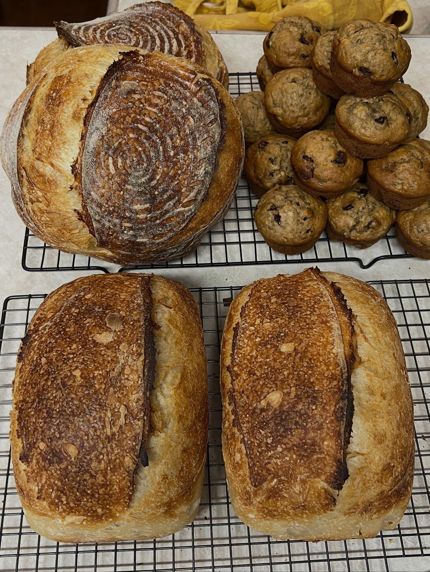 a close up of a person kneading dough on a table