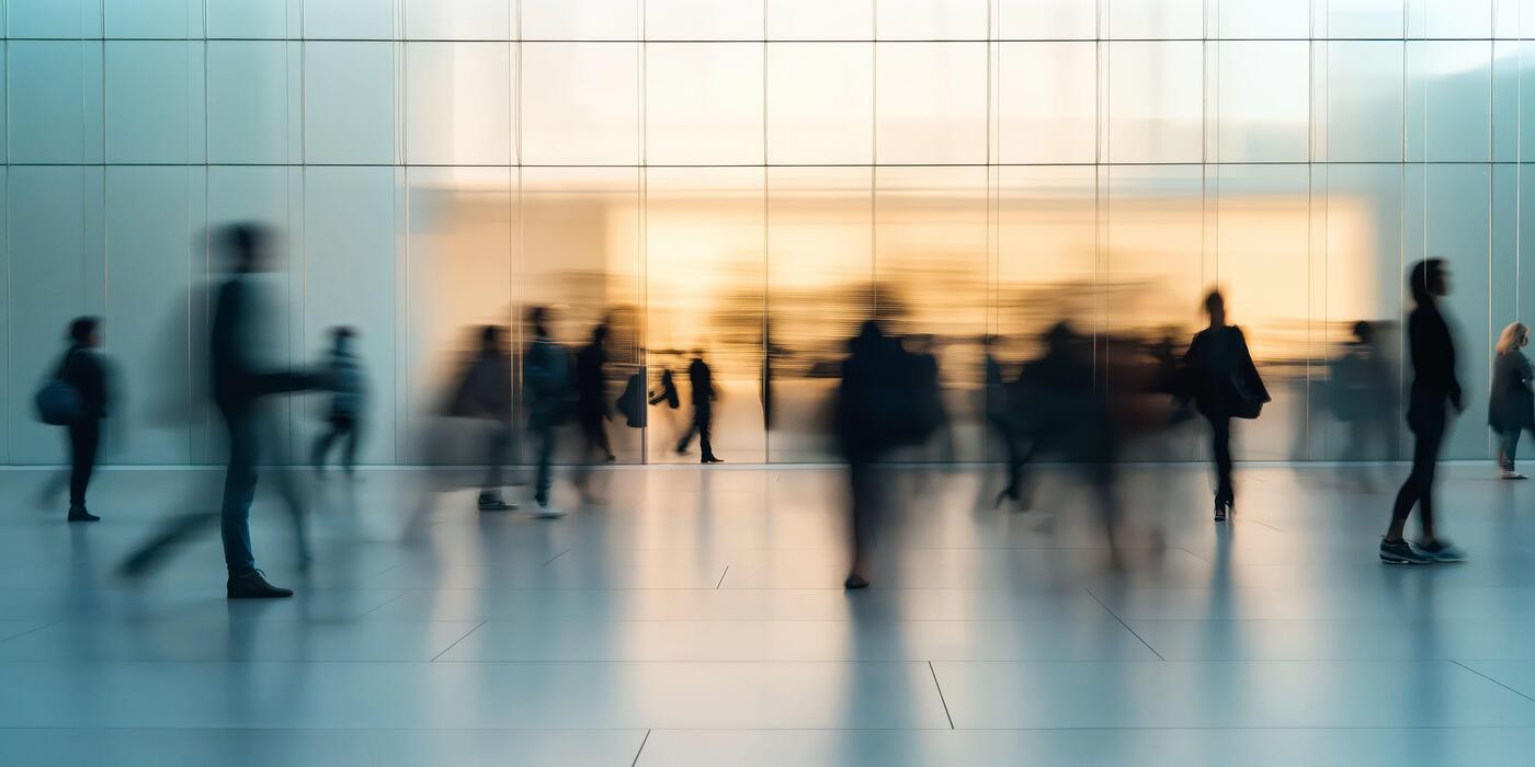 People rushing around a room