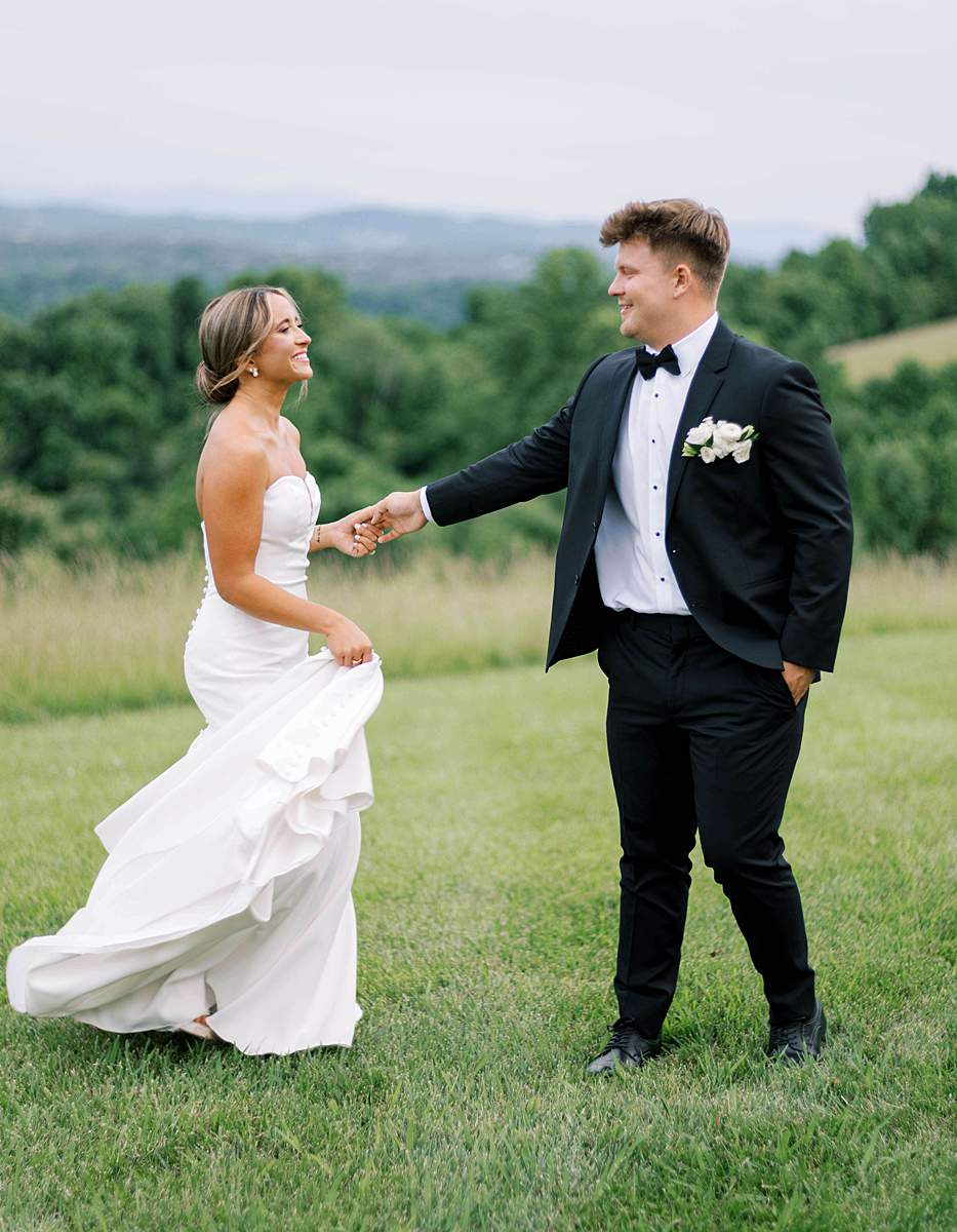 Bride and groom holding hands at chateau selah, East Tennessee wedding