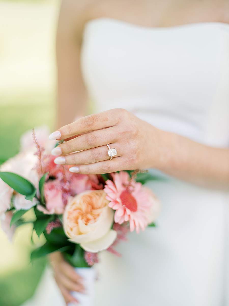 Close up detail of a bride resting her hand on her bouquet, the lake house piney flats tn.
