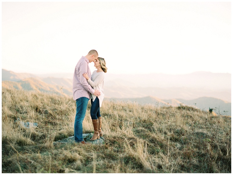 Emily and Zachary enjoying their TN Roan Mountain engagement session with scenic fall mountain views
