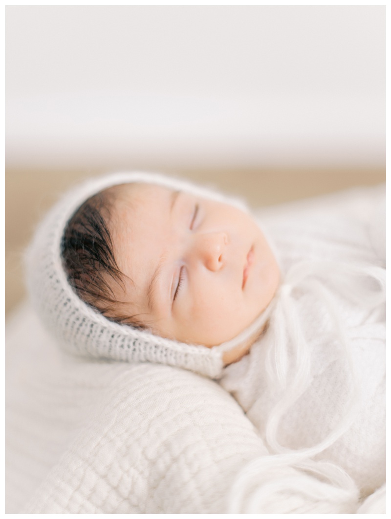 Parents holding newborn gently in Kingsport TN studio