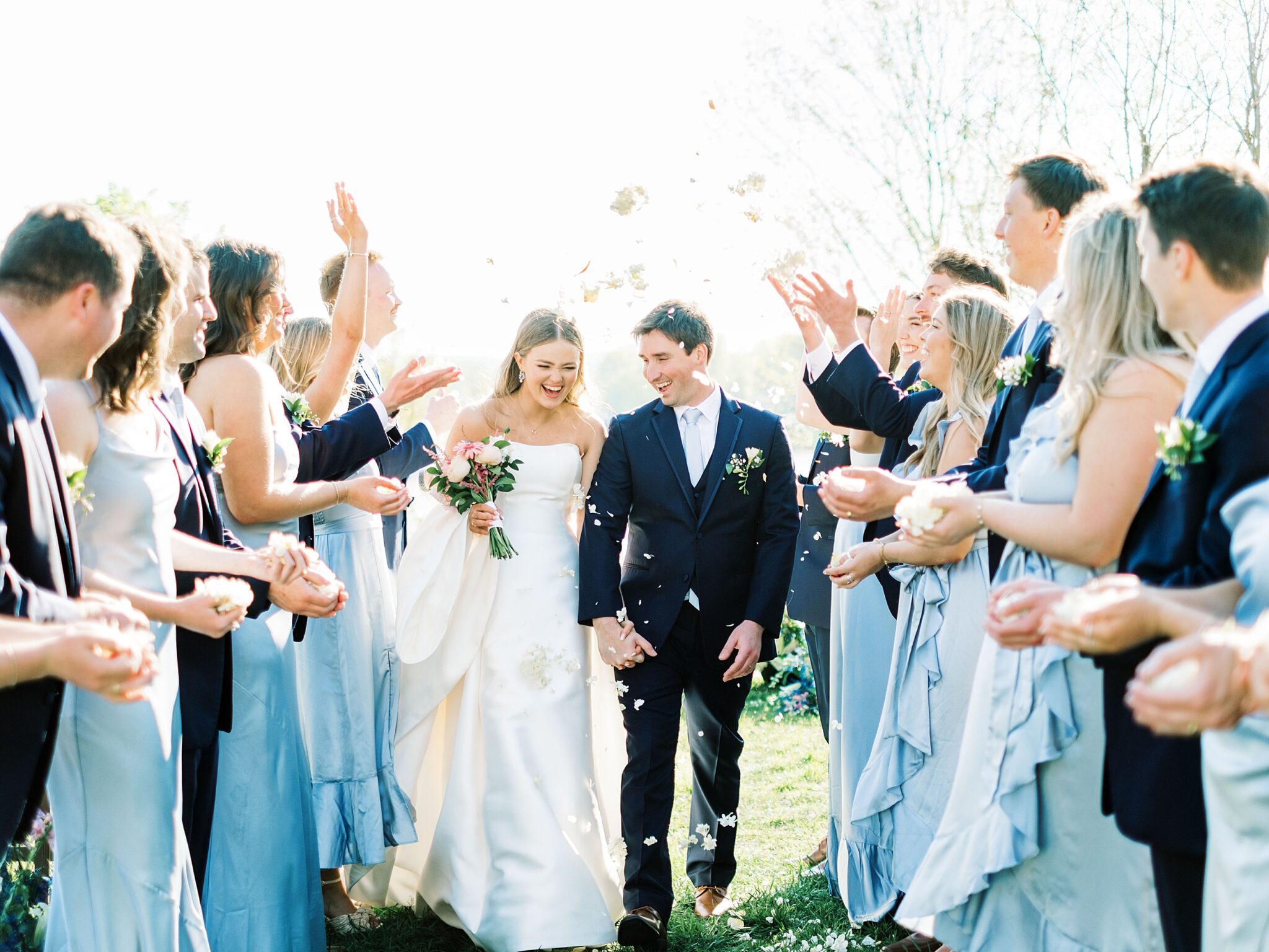 bride and groom holding hands at Lake House wedding venue TN