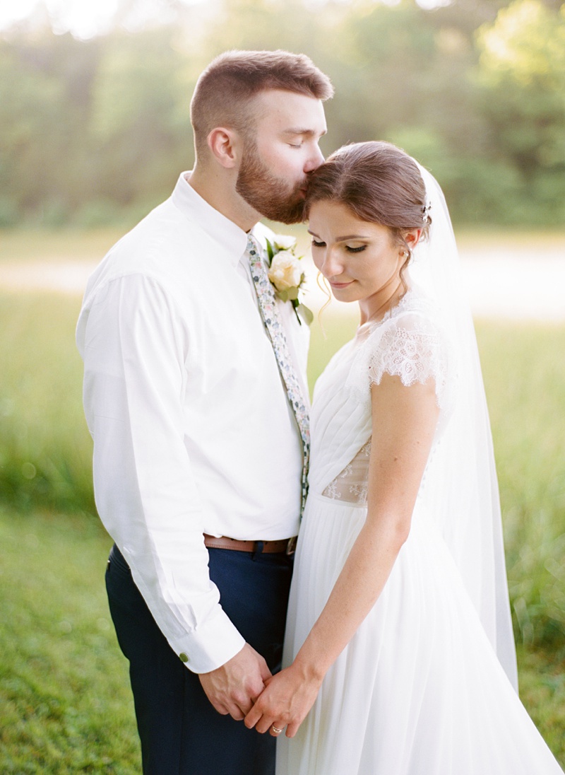 couple walking in meadow Hidden Meadows TN