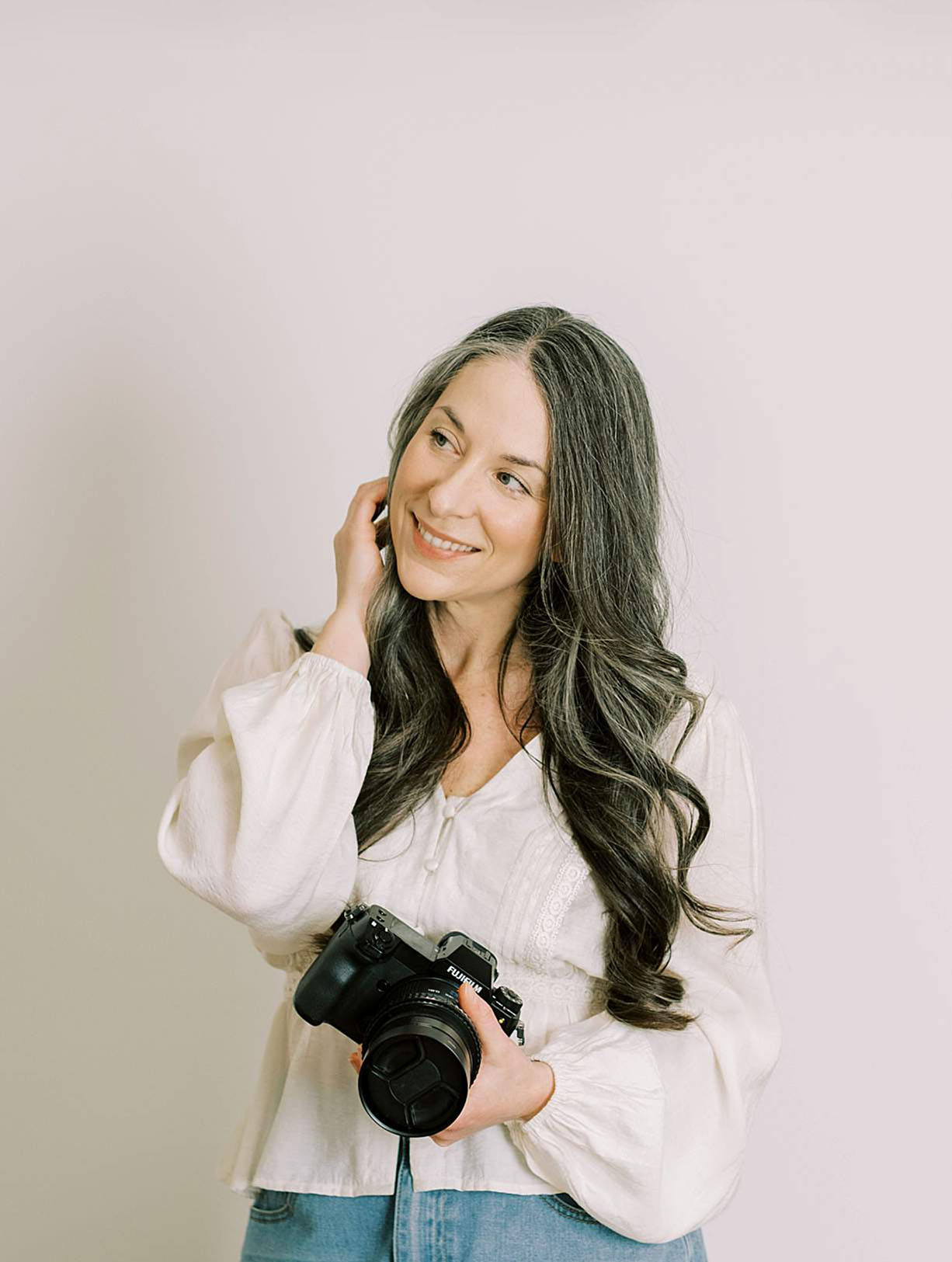 Professional headshot of woman smiling in natural light, Tri-Cities TN