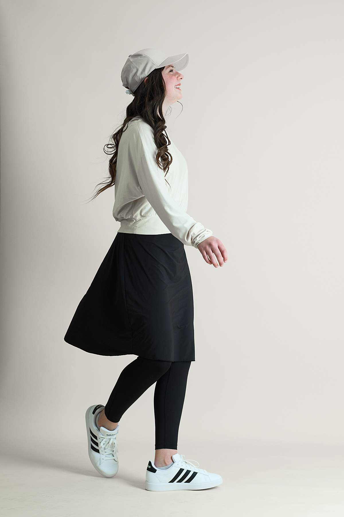 Young girl wearing a black modest athletic skirt