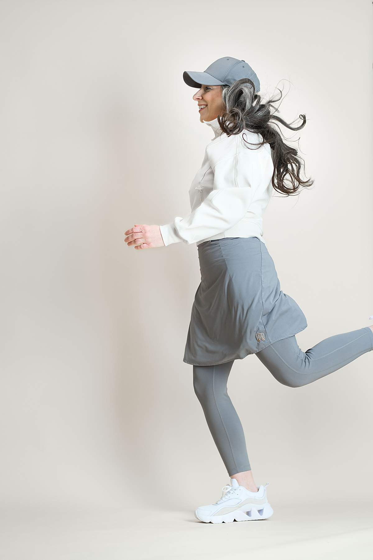 Woman wearing a grey modest athletic skirt