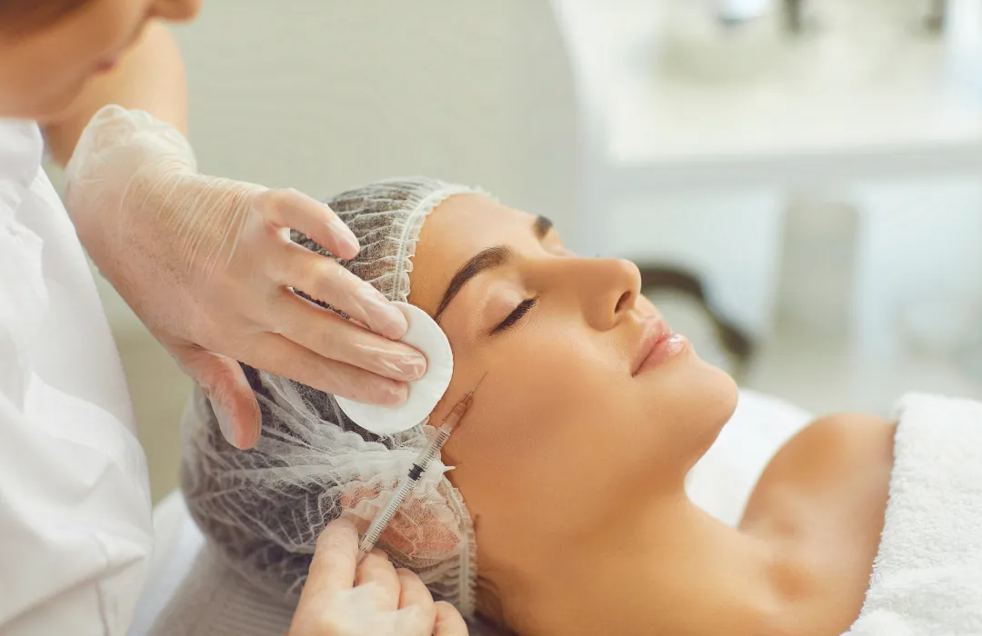 person standing on rock formation surrounded by body of water