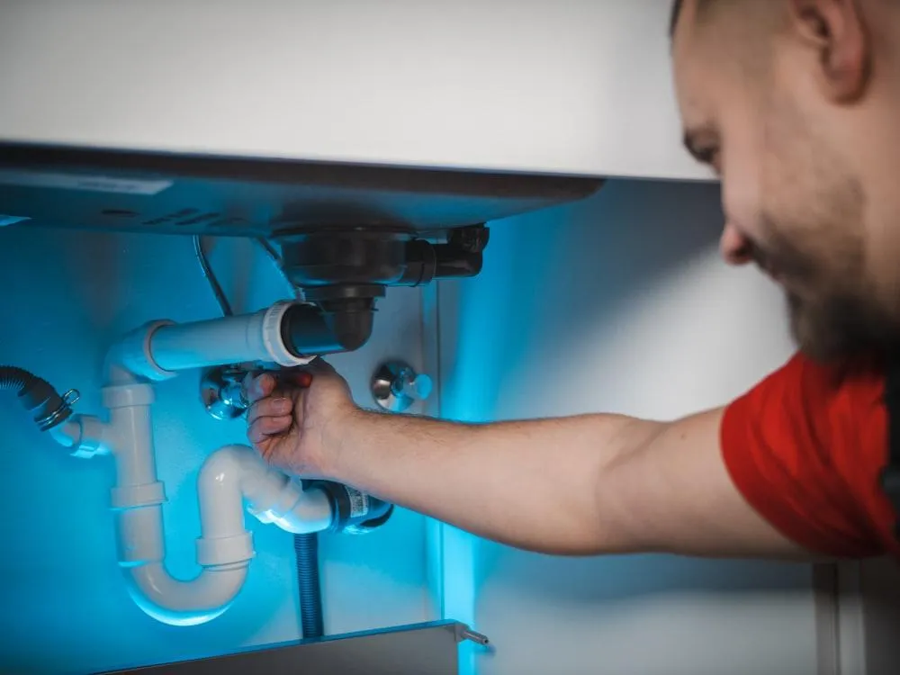 Technician testing a newly installed water heater for reliable performance