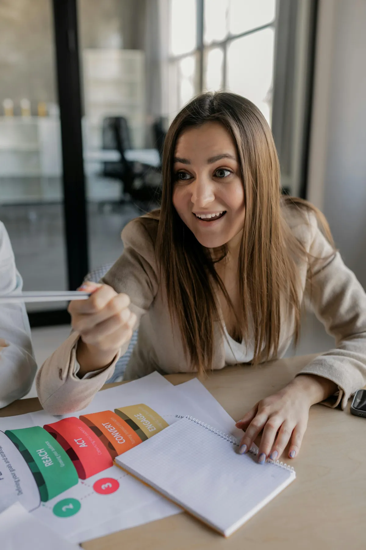 woman reading book while sitting on chair