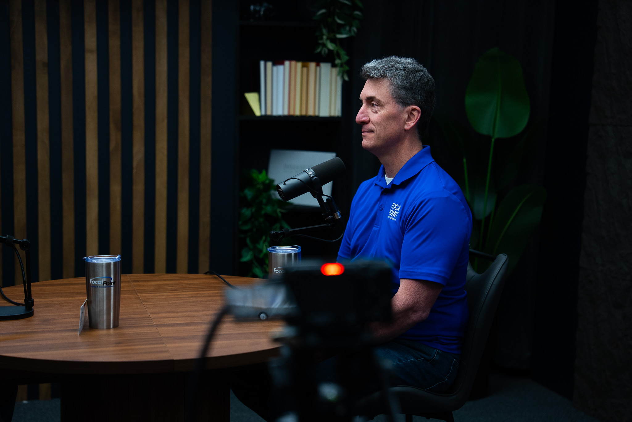 Business consultant delivering a course lesson on camera at Cincinnati Podcast Studio