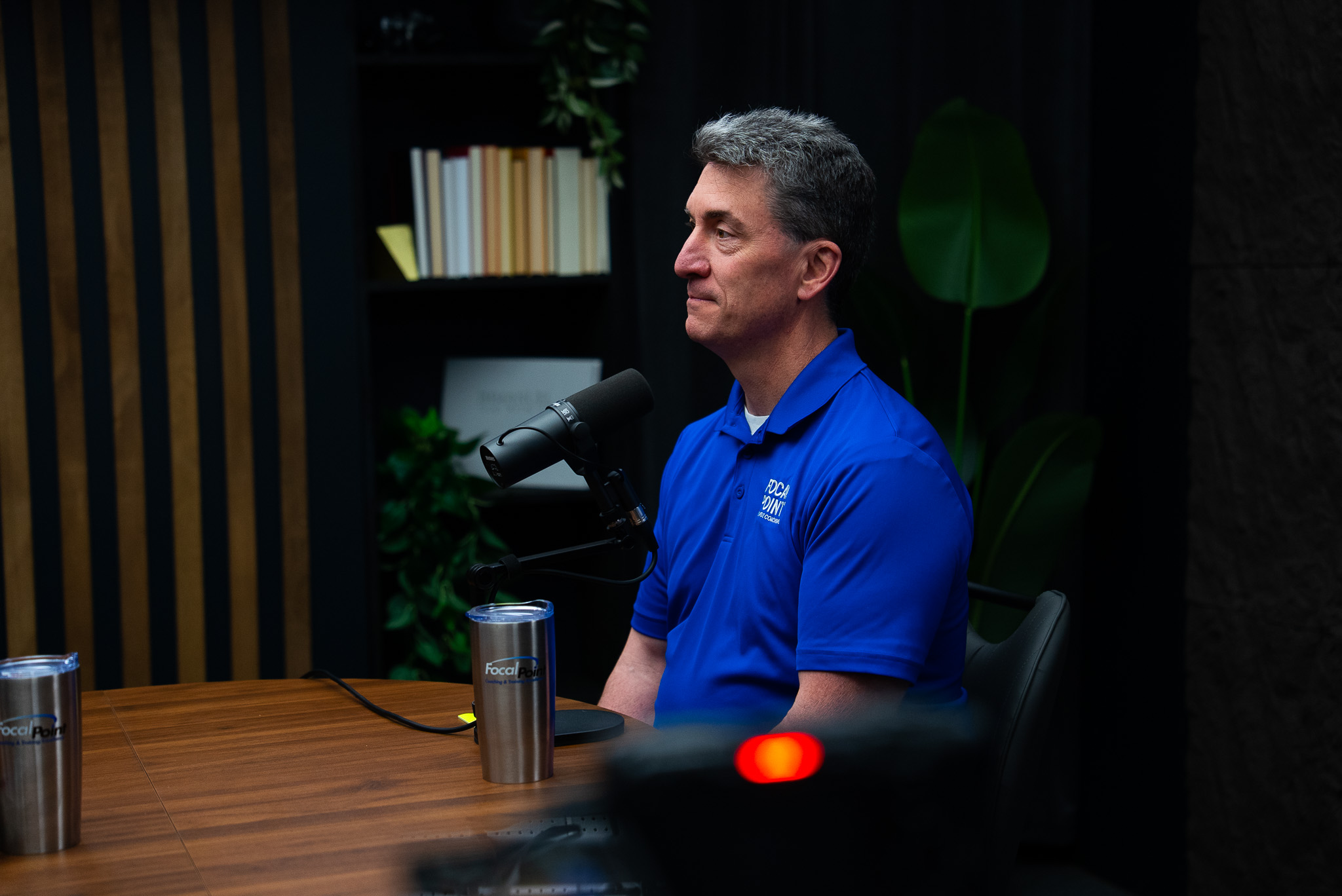 Subject-matter expert recording educational video content in a professional studio