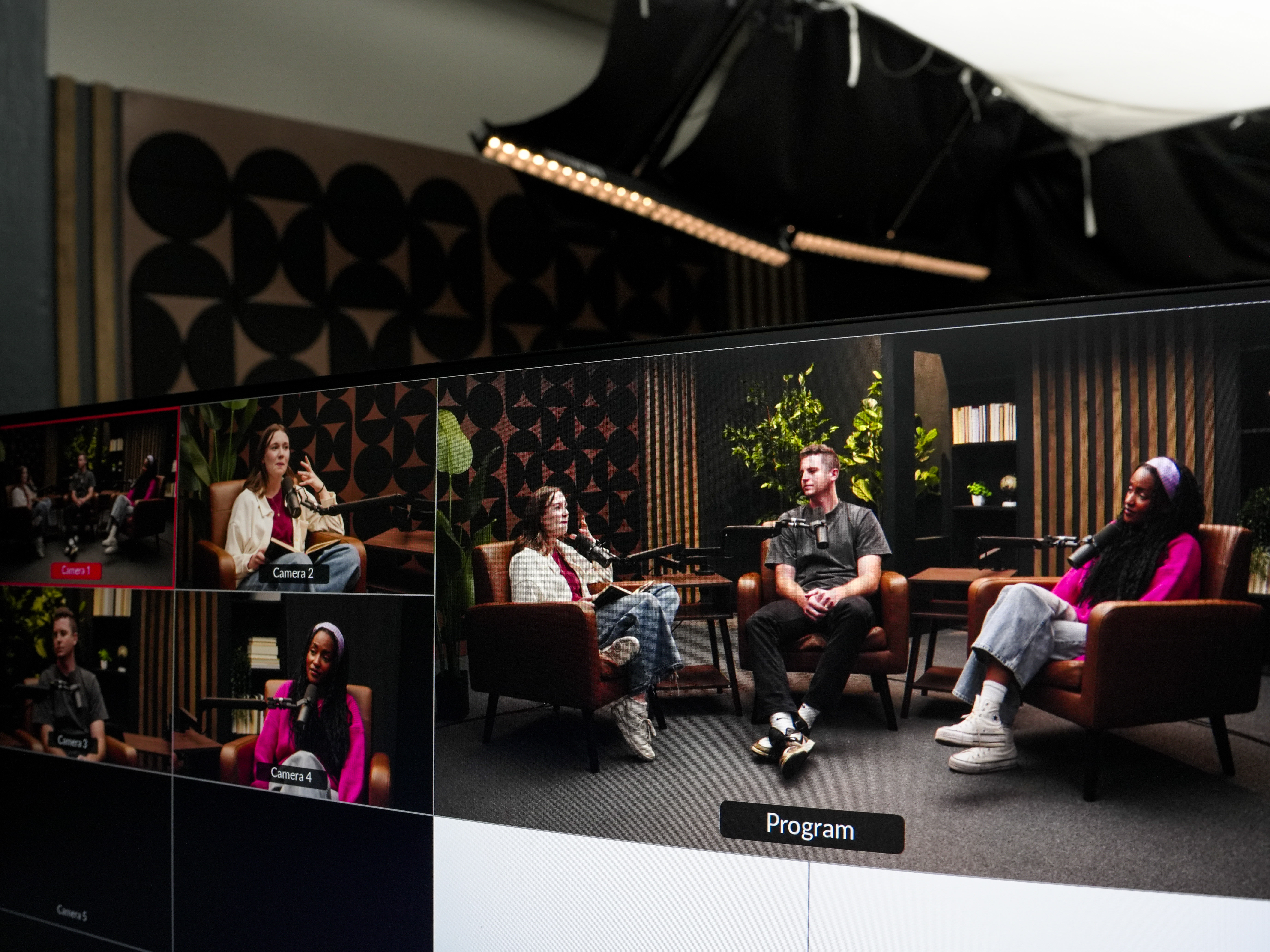 Group of business professionals in a studio session discussing content strategy