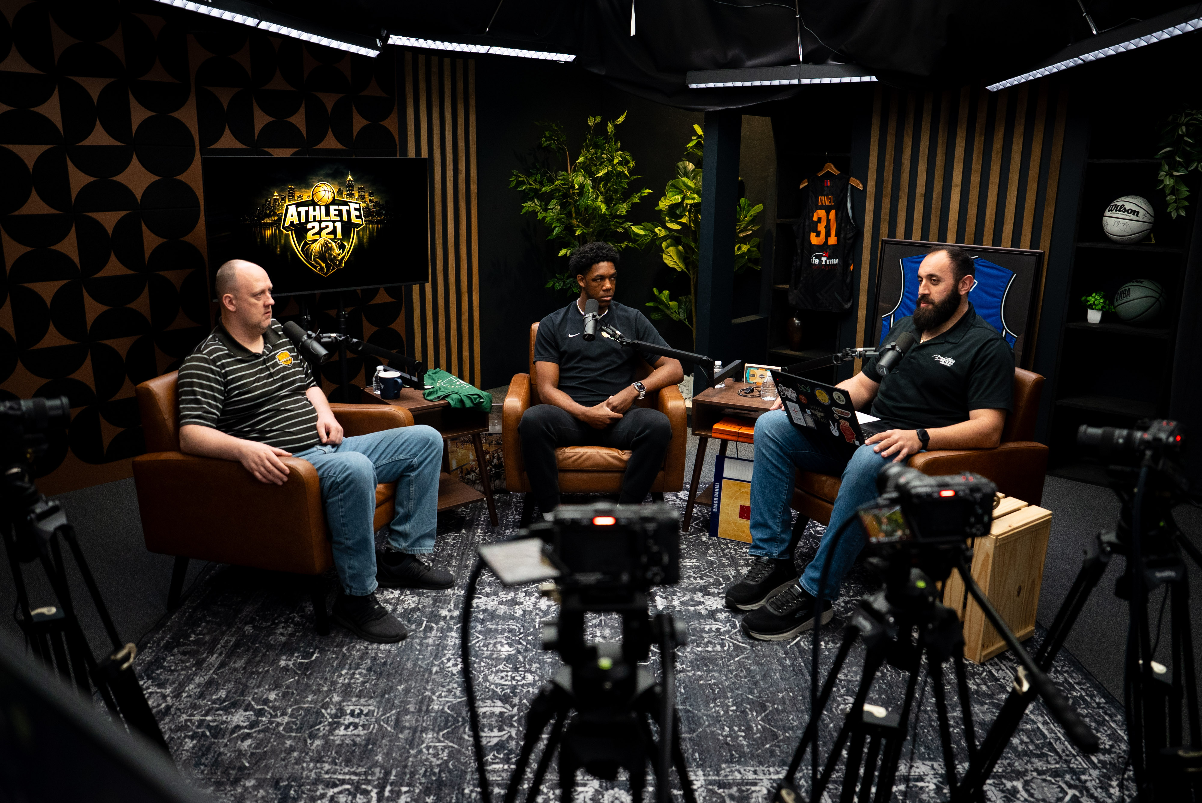 Three B2B professionals collaborating in a professional studio environment