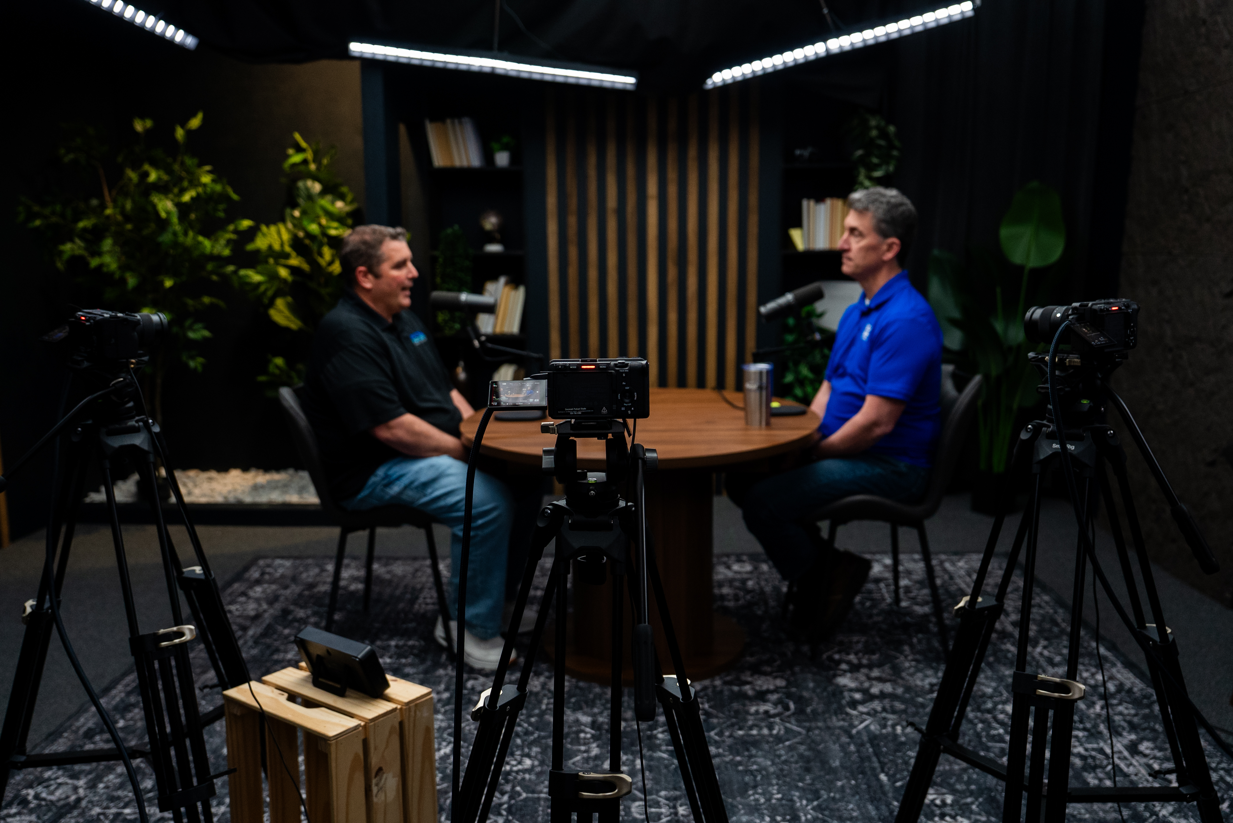 Two-person podcast interview being filmed in a professional Cincinnati podcast studio