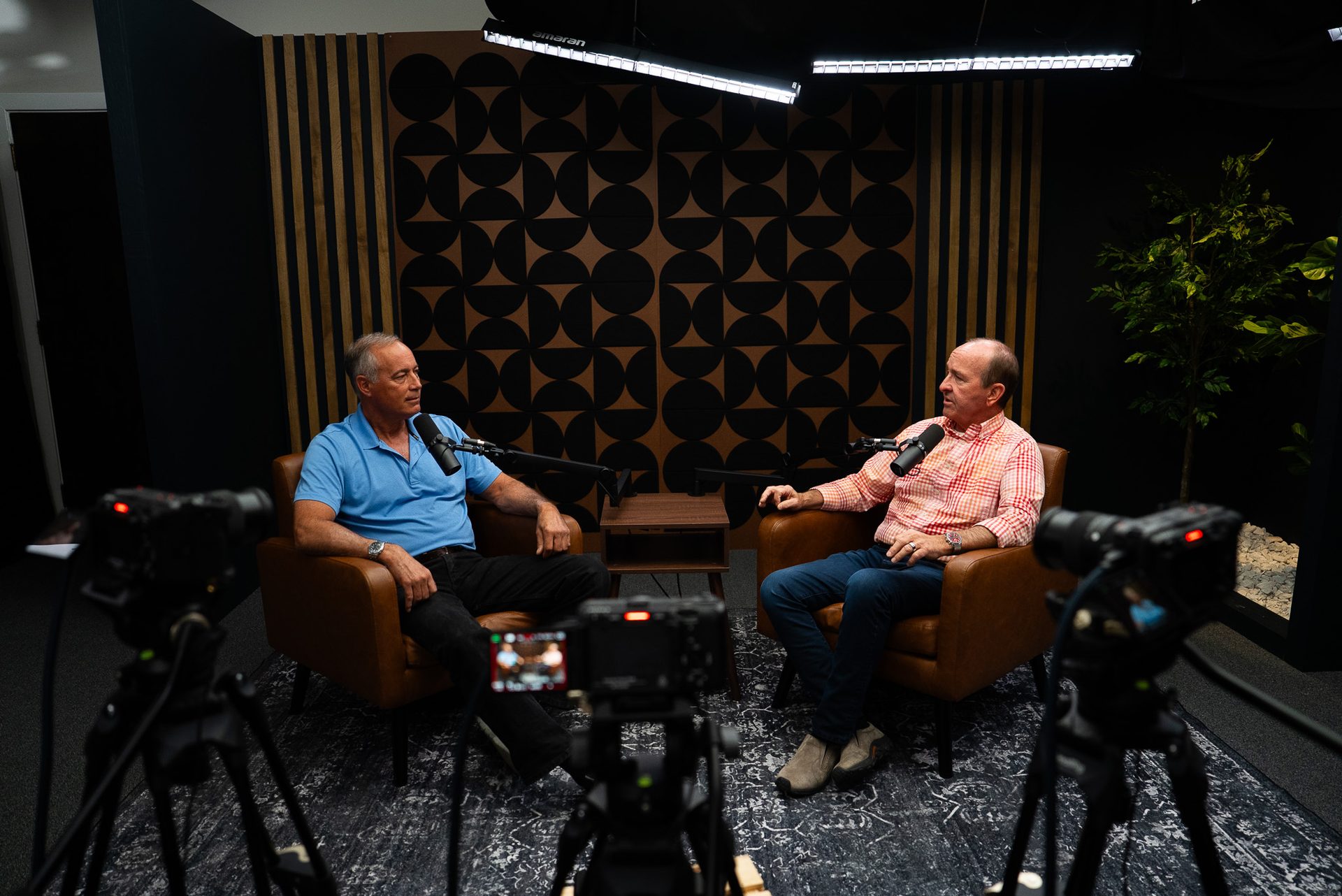 Professional lighting and camera setup in a podcast studio