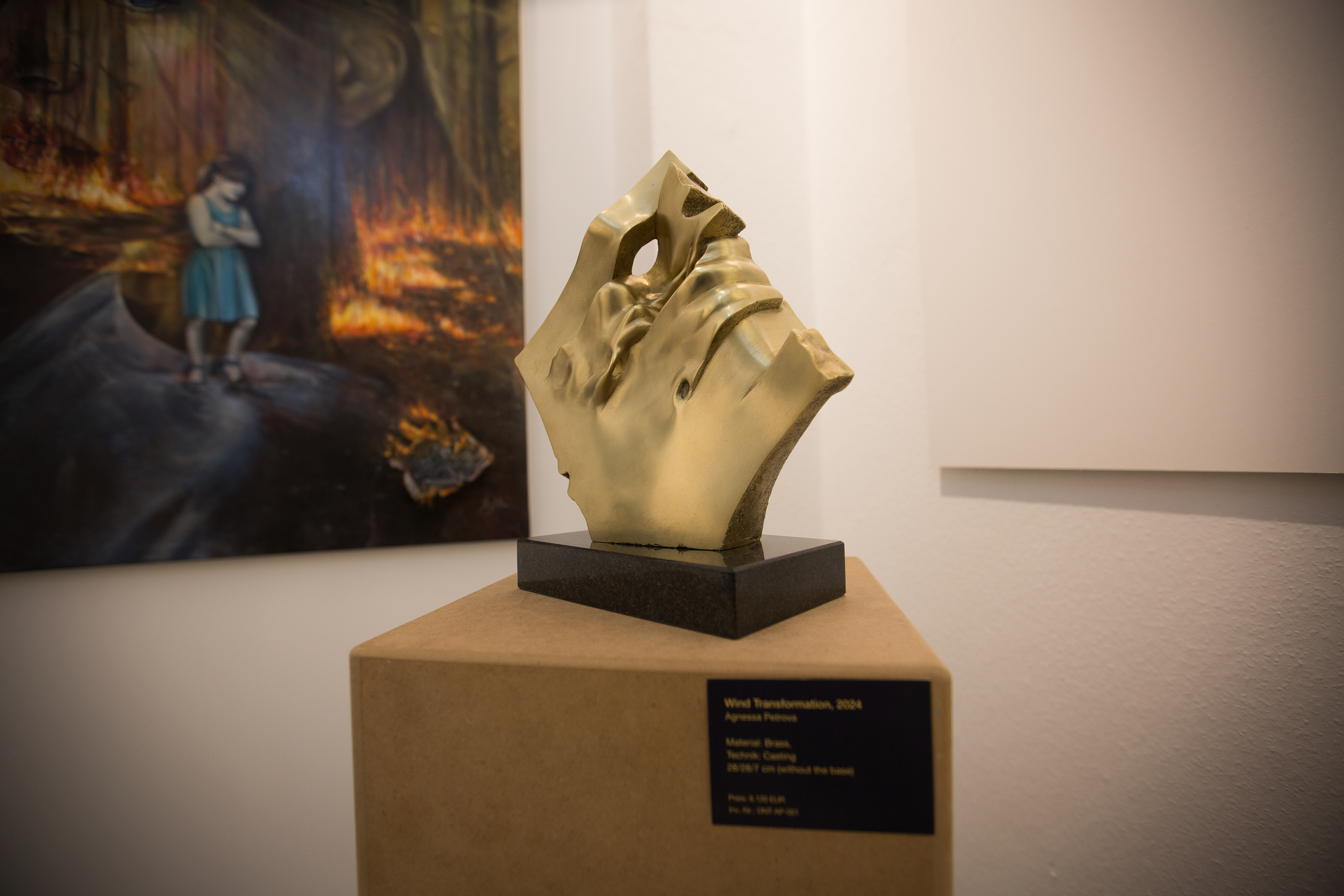 A luminous, ethereal gallery space with beams of natural light illuminating abstract sculptures and minimalist paintings. The atmosphere is serene, with soft gold and porcelain tones, and a sense of spiritual elevation. No people are present, emphasizing the interplay of light and substance.