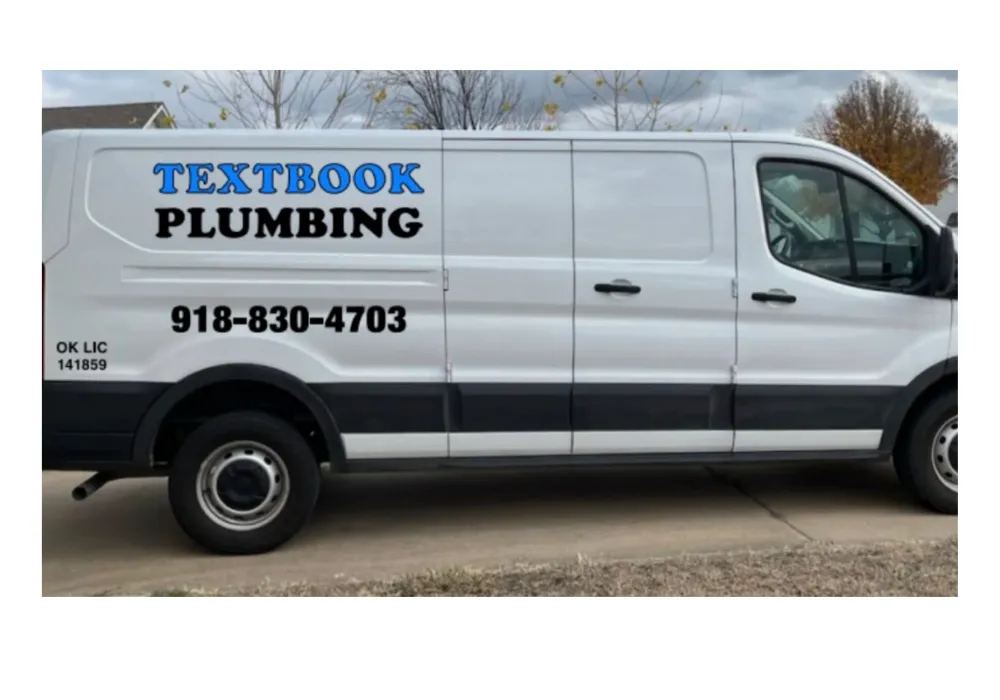 Plumber repairing toilet in residential bathroom