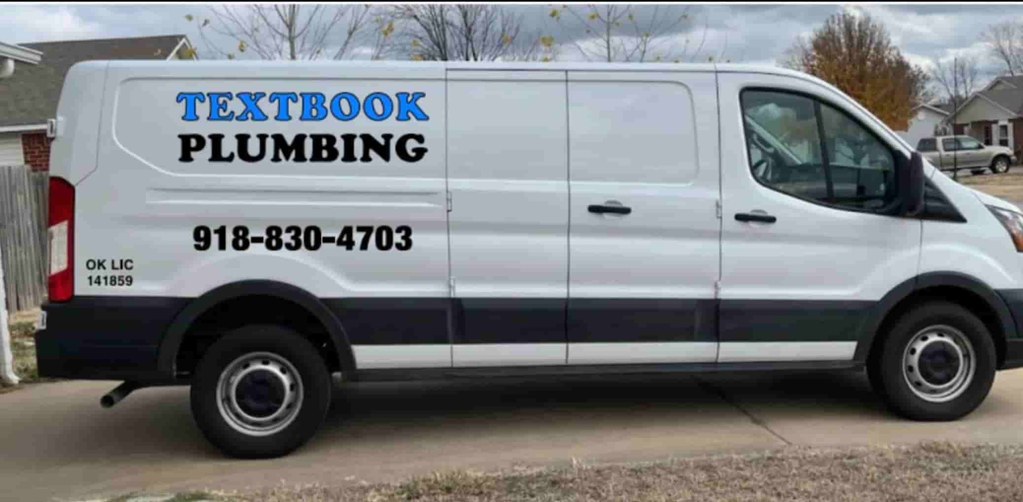 Plumber repairing toilet in residential bathroom