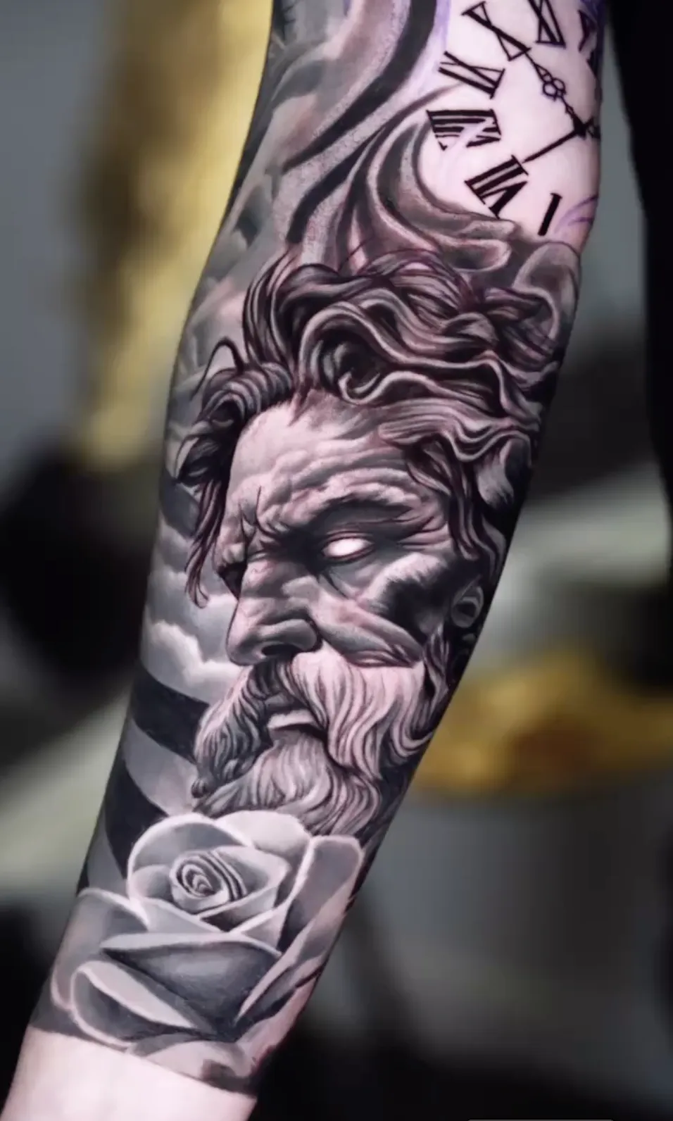 person with tattoo on right arm