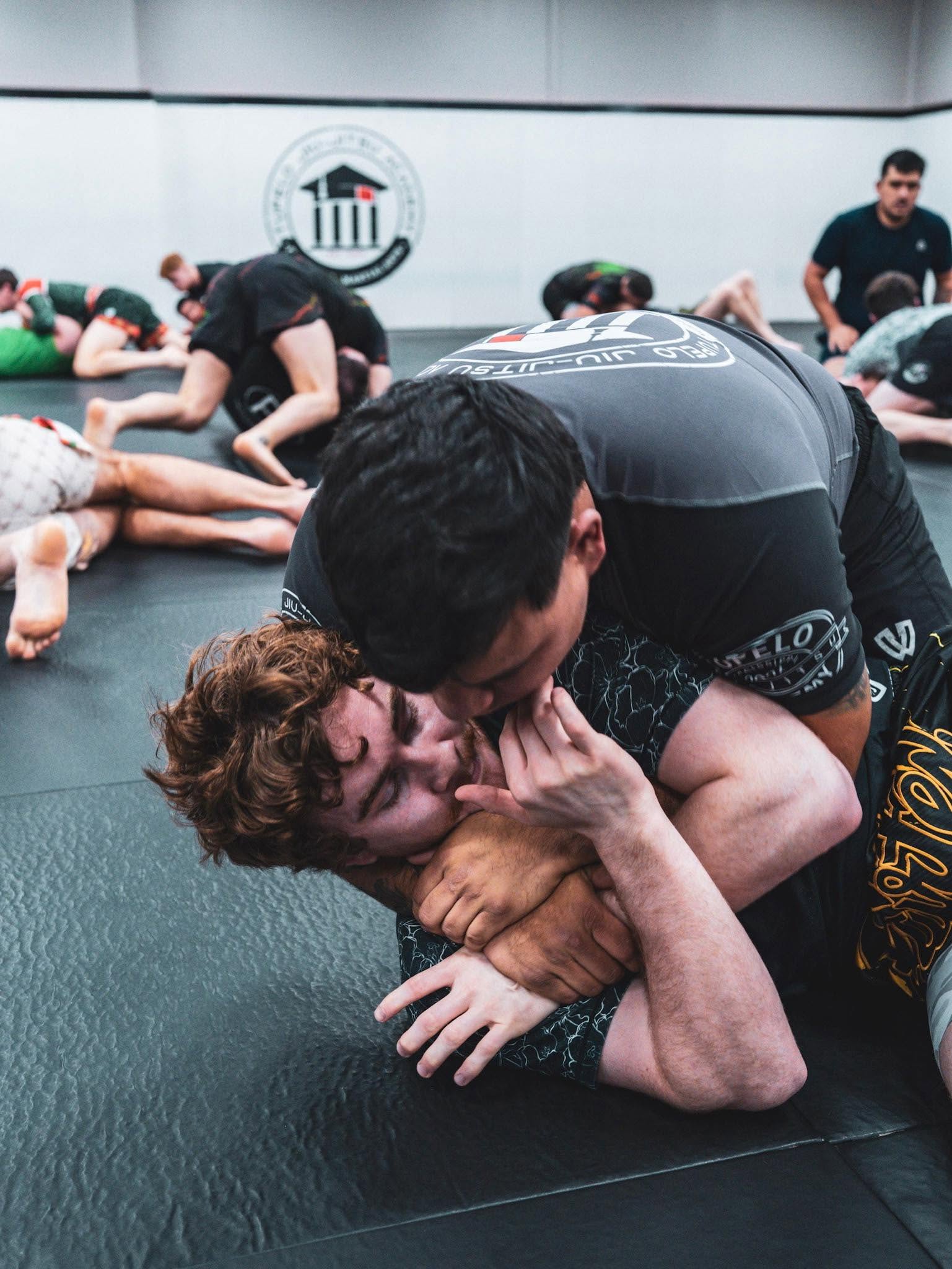 Jiu Jitsu students training during class at Tupelo Jiu Jitsu Academy