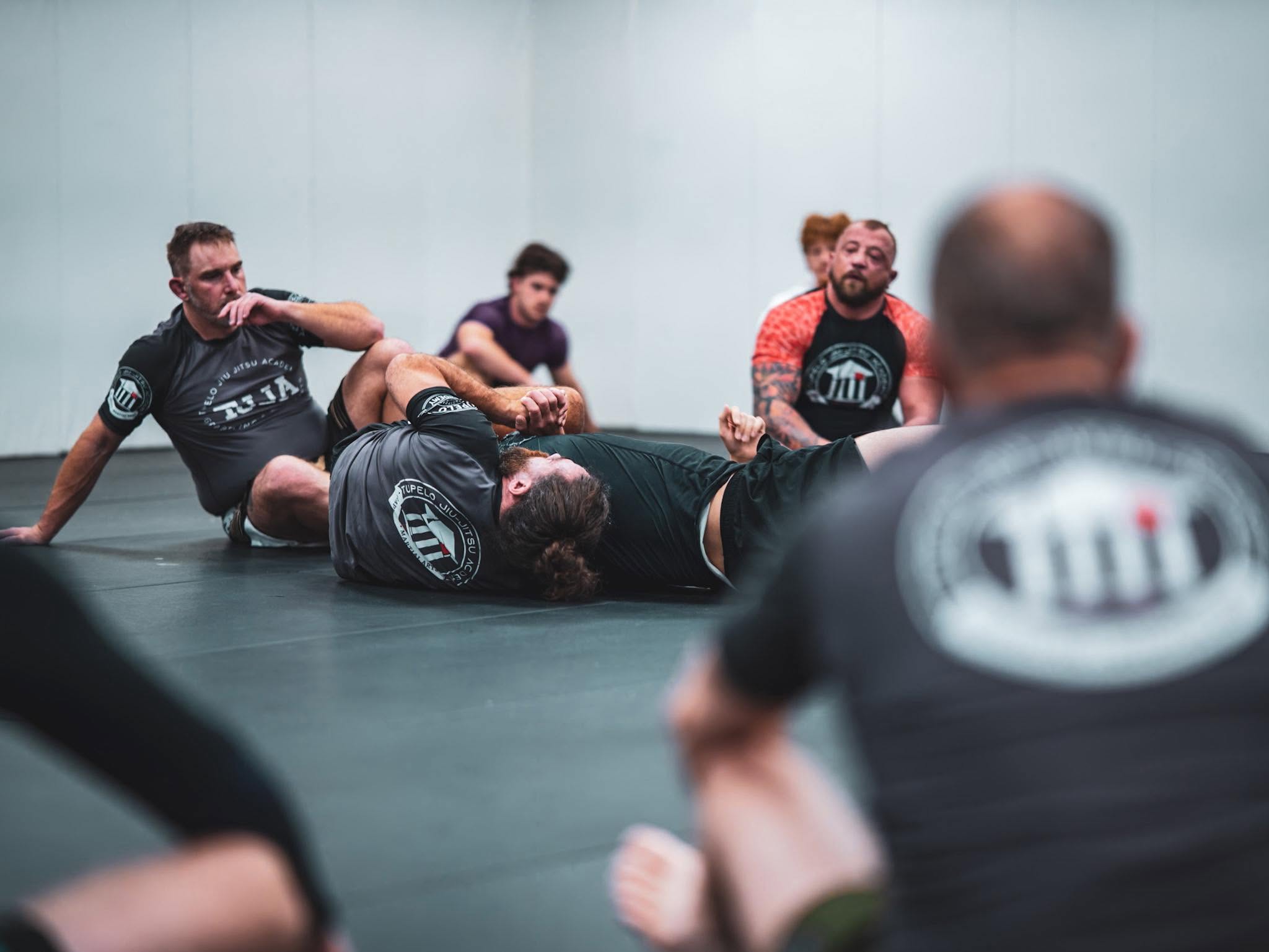 Students practicing Brazilian Jiu Jitsu during live training at Tupelo Jiu Jitsu Academy