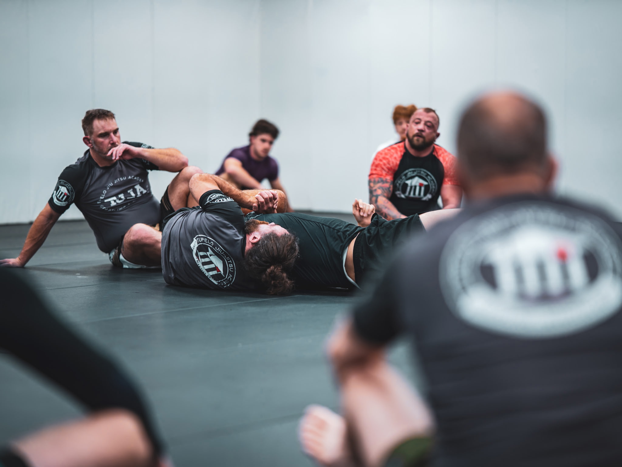 Students practicing live Brazilian Jiu Jitsu grappling at Tupelo Jiu Jitsu Academy