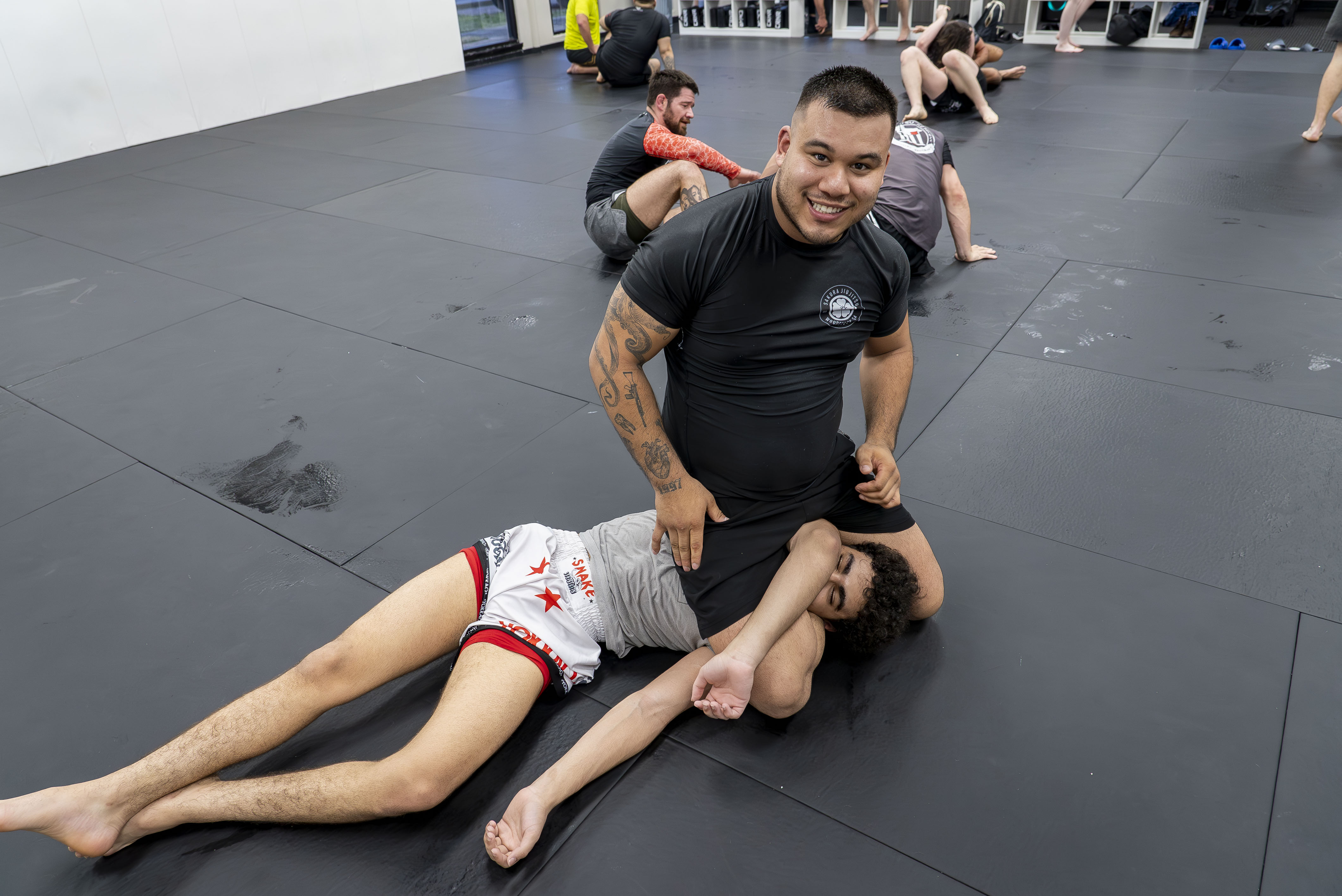 Brazilian Jiu Jitsu instructor demonstrating a grappling technique at Tupelo Jiu Jitsu Academy