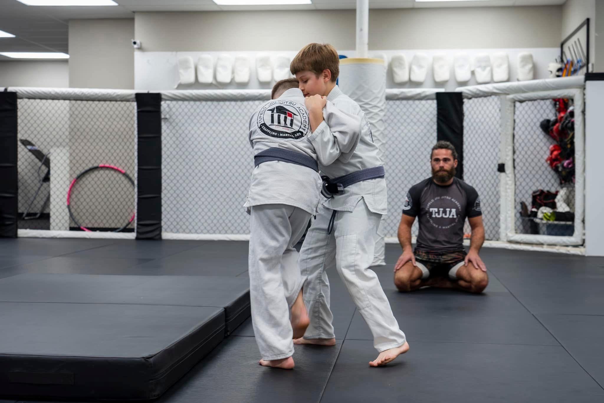 Kids Brazilian Jiu Jitsu students practicing techniques at Tupelo Jiu Jitsu Academy