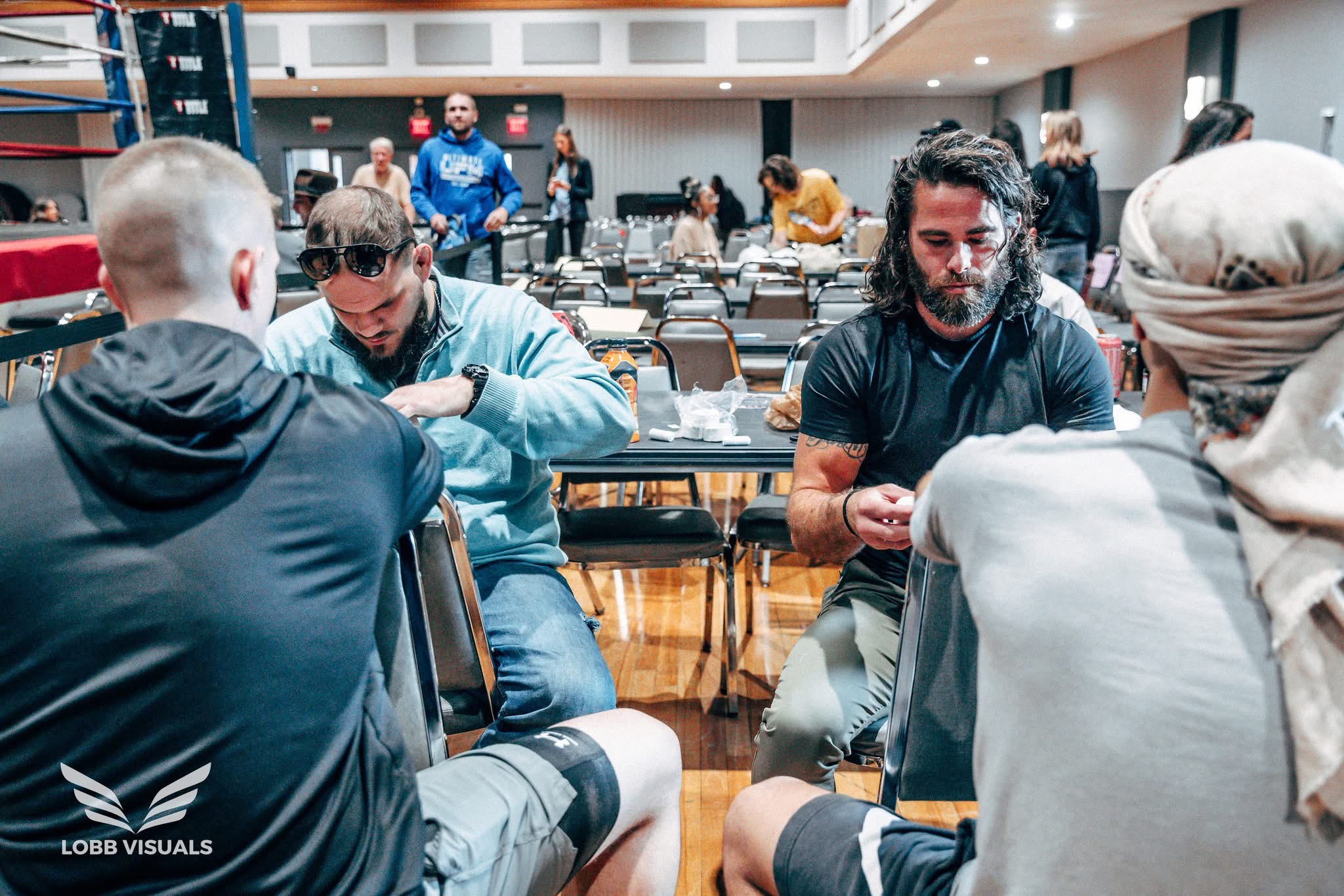 1. Tupelo Jiu Jitsu Academy team members preparing together at a martial arts competition