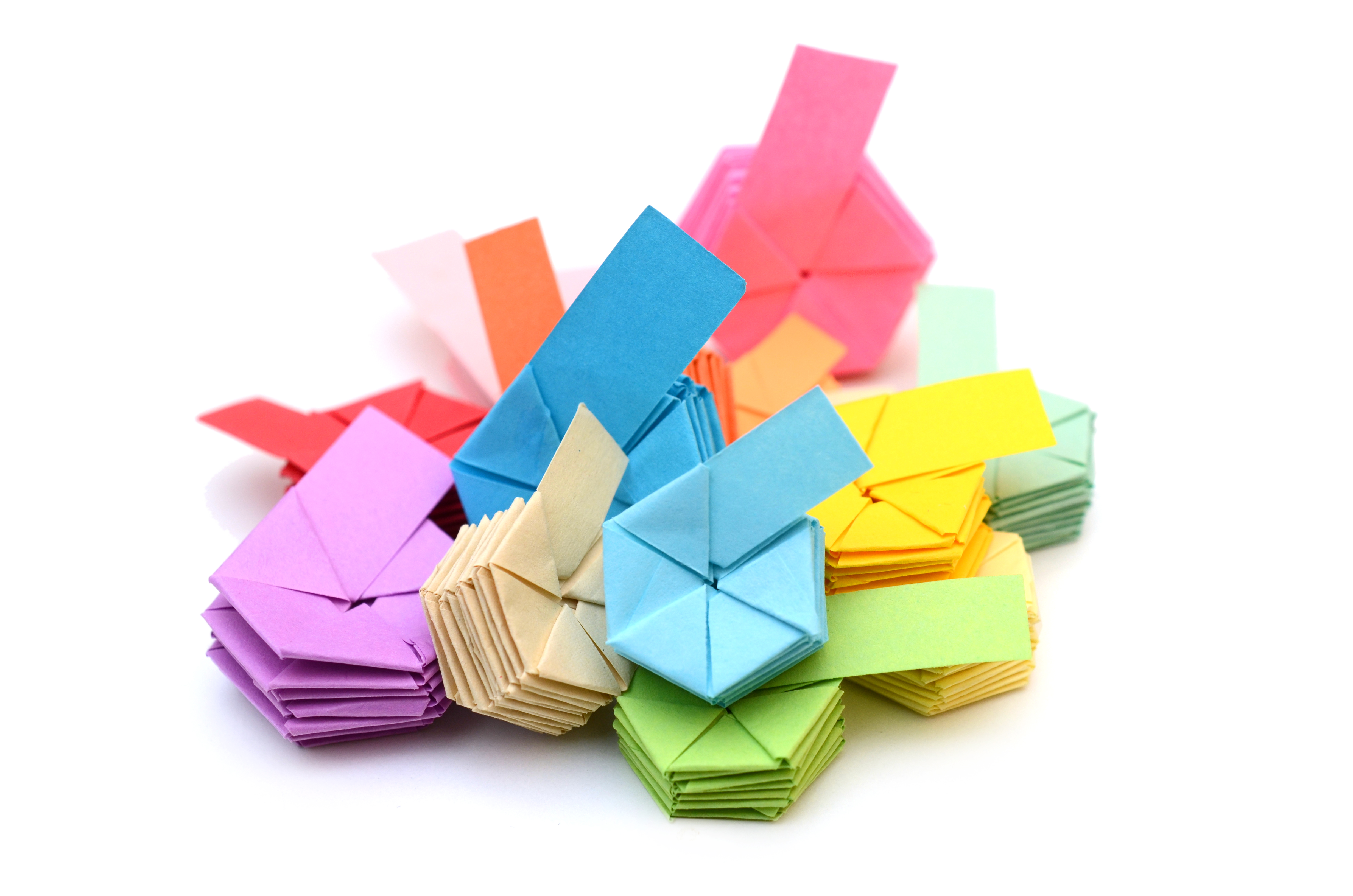 A pile of brightly coloured origami hexagons