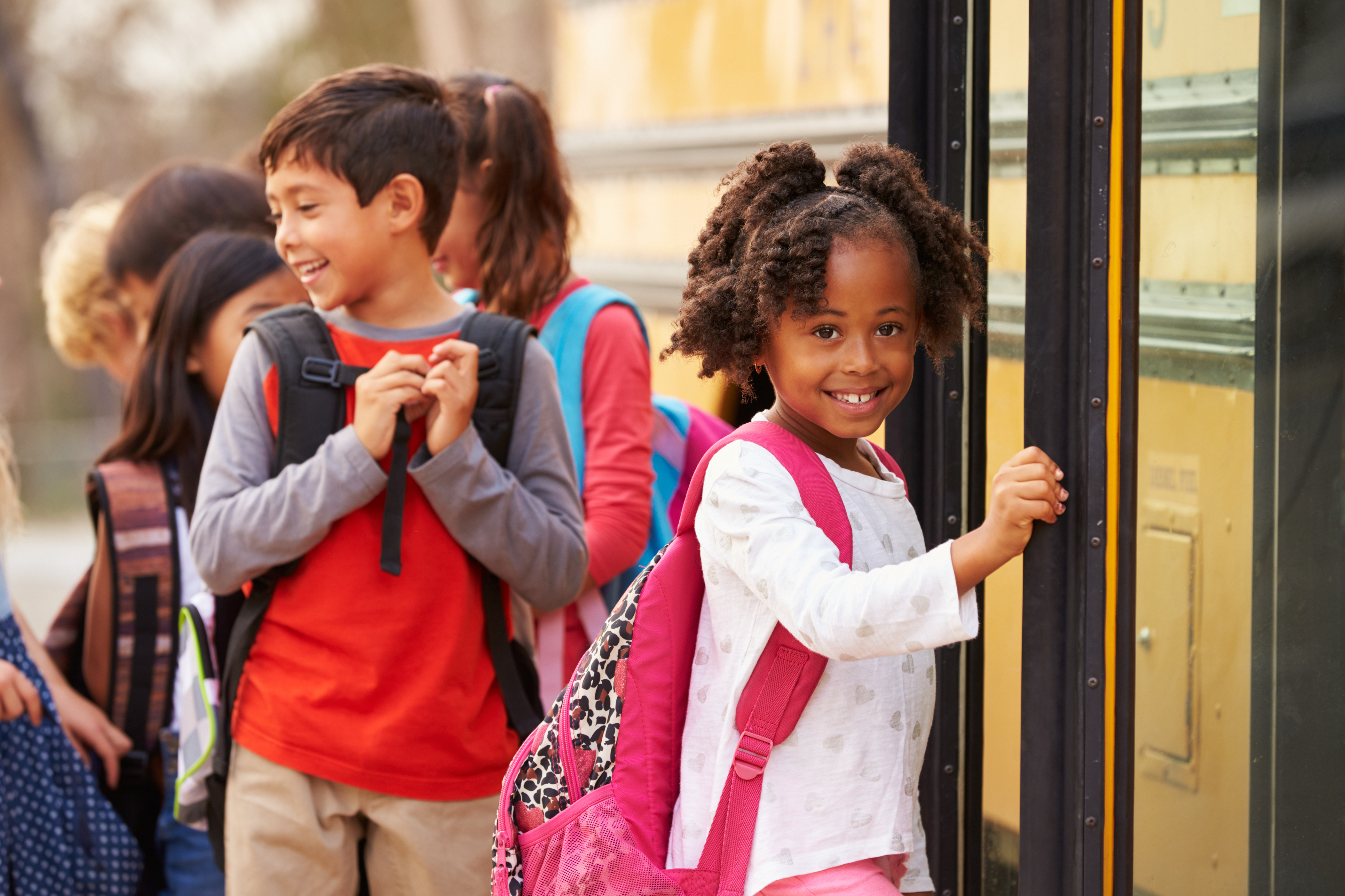 child smiling inside of daycare program