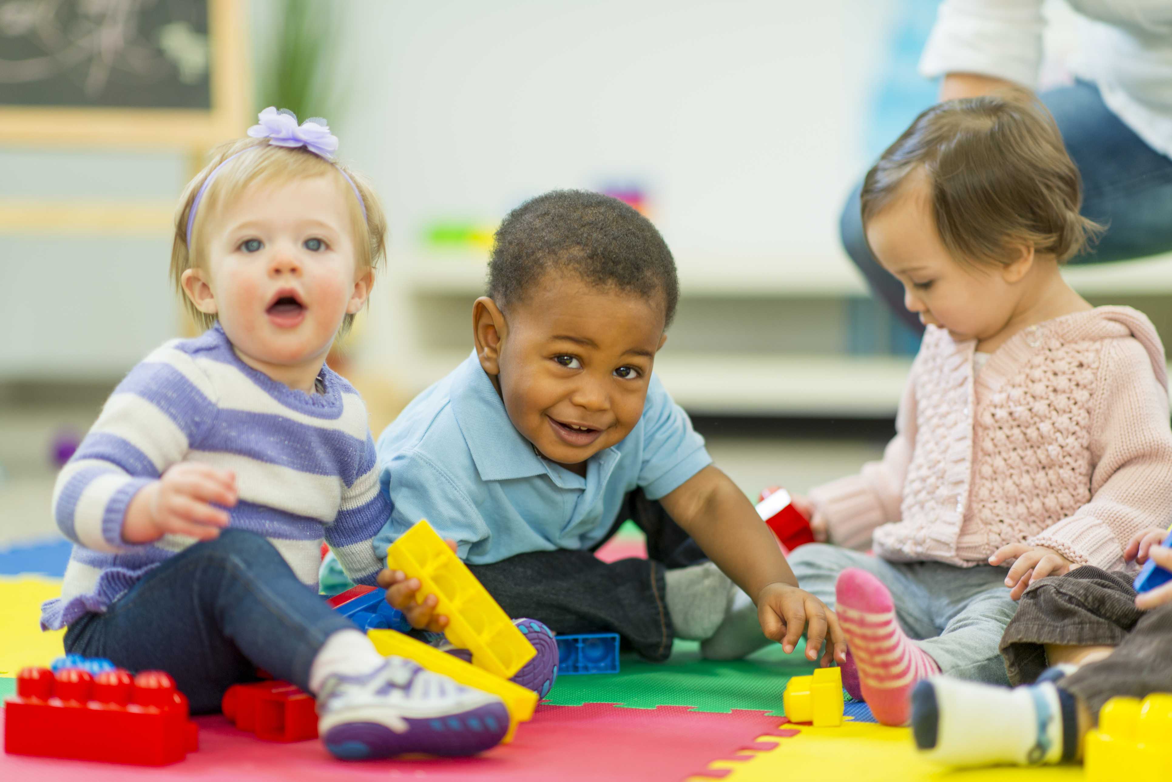 Child smiling while actively sing cognitive skills