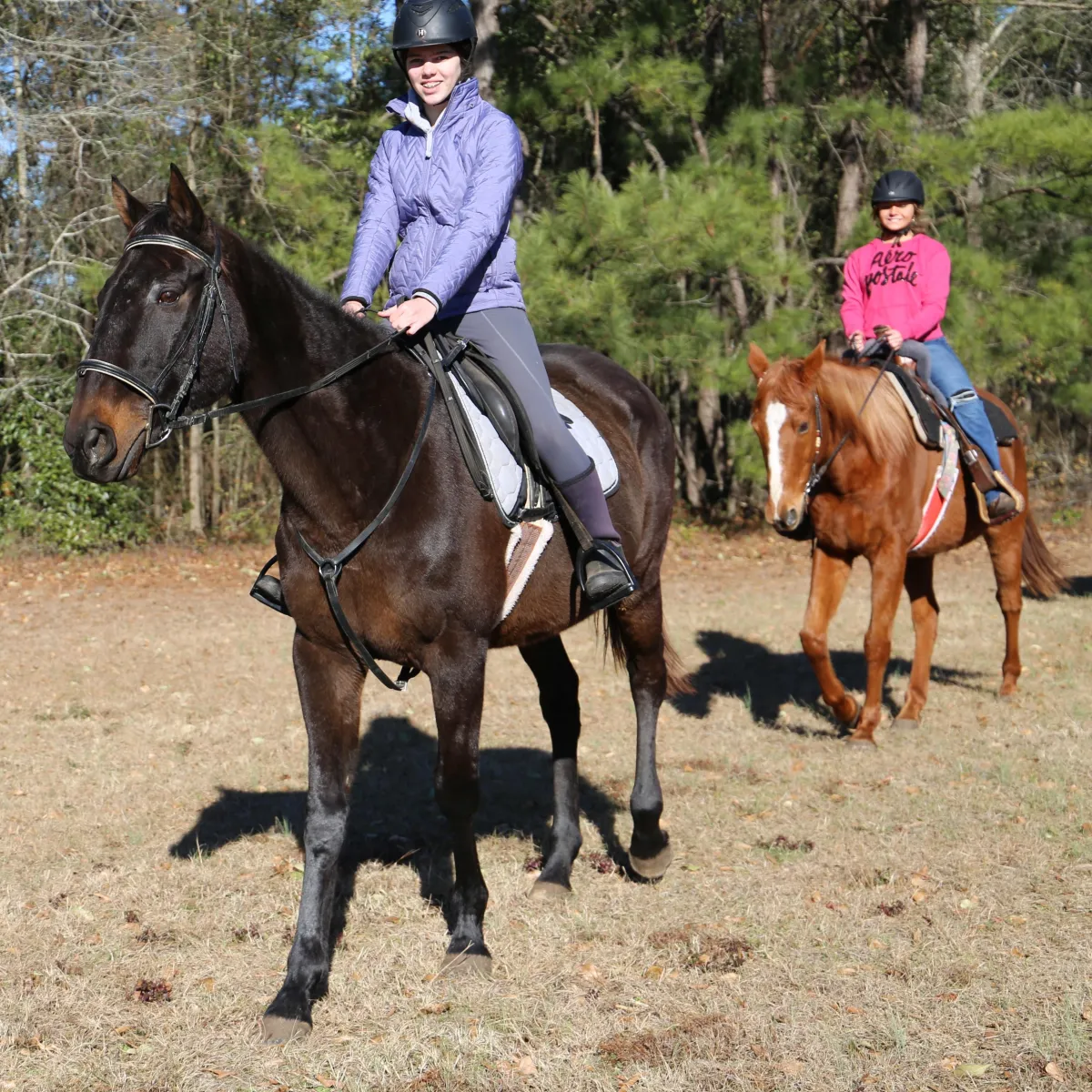 Two girls on a trail ride at Winter Camp